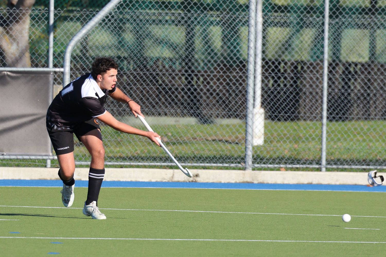 Hawke's Bay U18 Hockey defensive Player clears the ball in 2025.