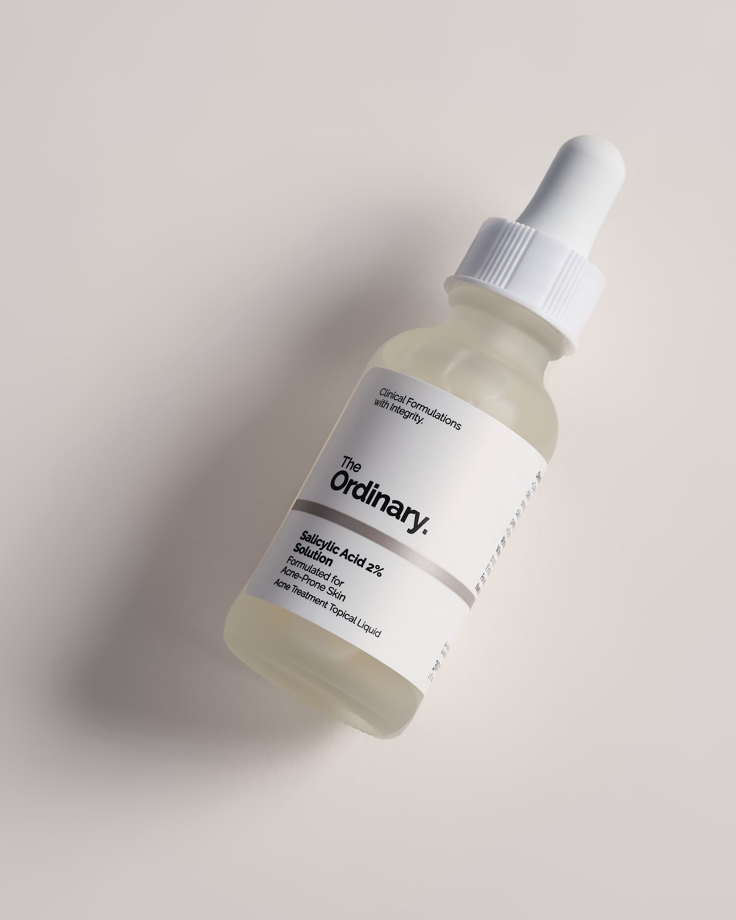 The Ordinary Salicylic Acid 2% Solution serum in a frosted glass dropper bottle on a neutral background.