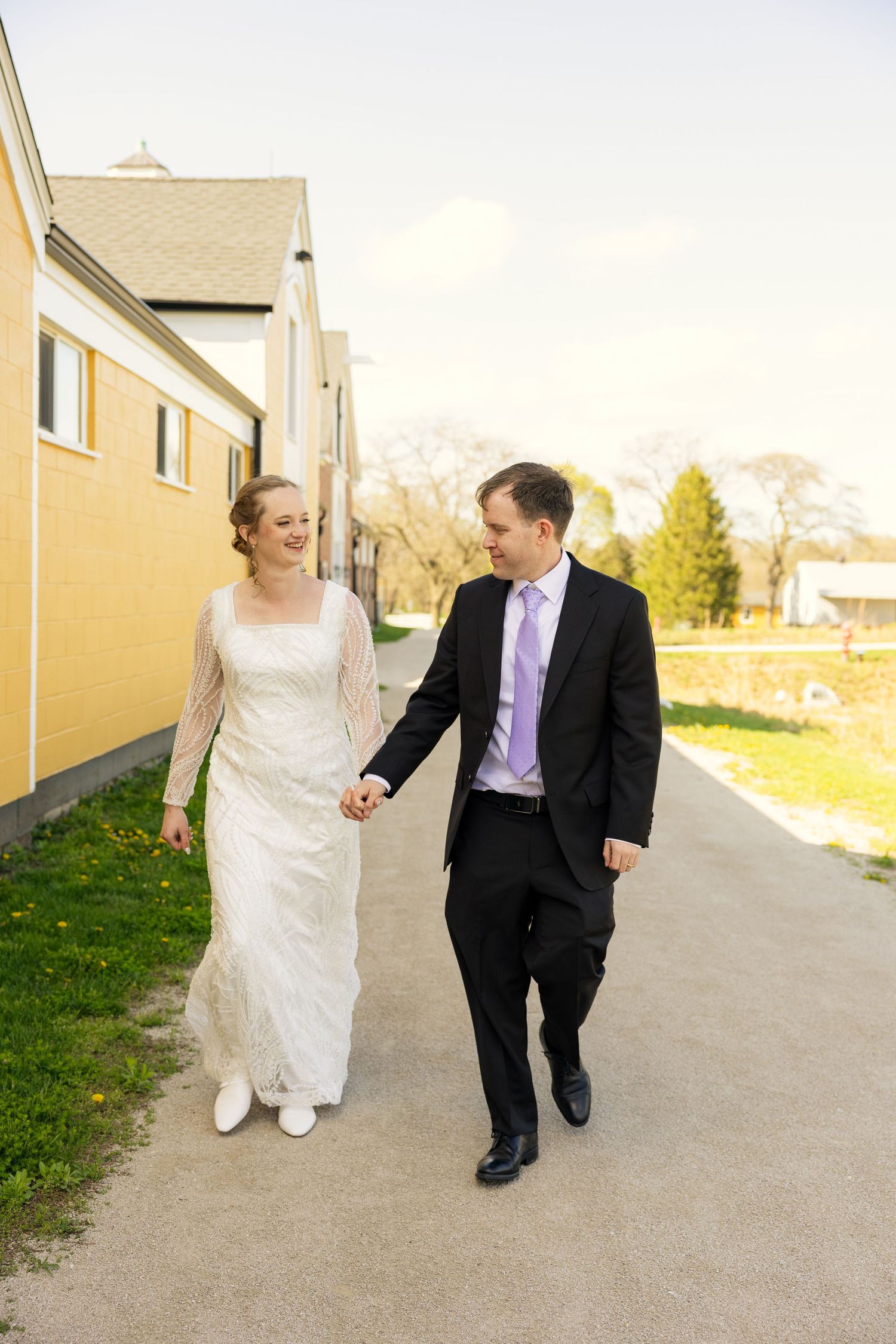 Bride and Groom walking after their wedding ceremony at St James in Warrenville, Illinois.