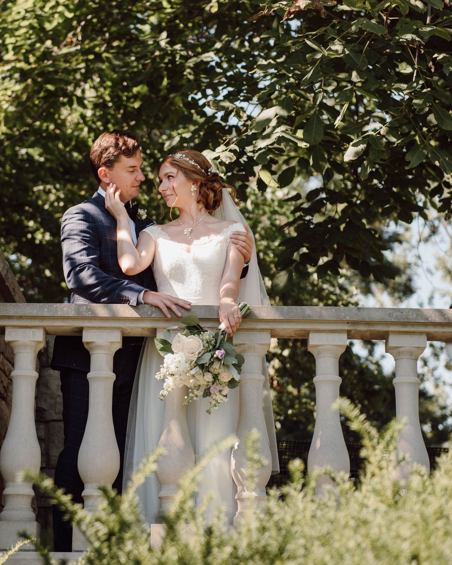 The bride and groom looking lovingly into each other's eyes at Paletta Mansion