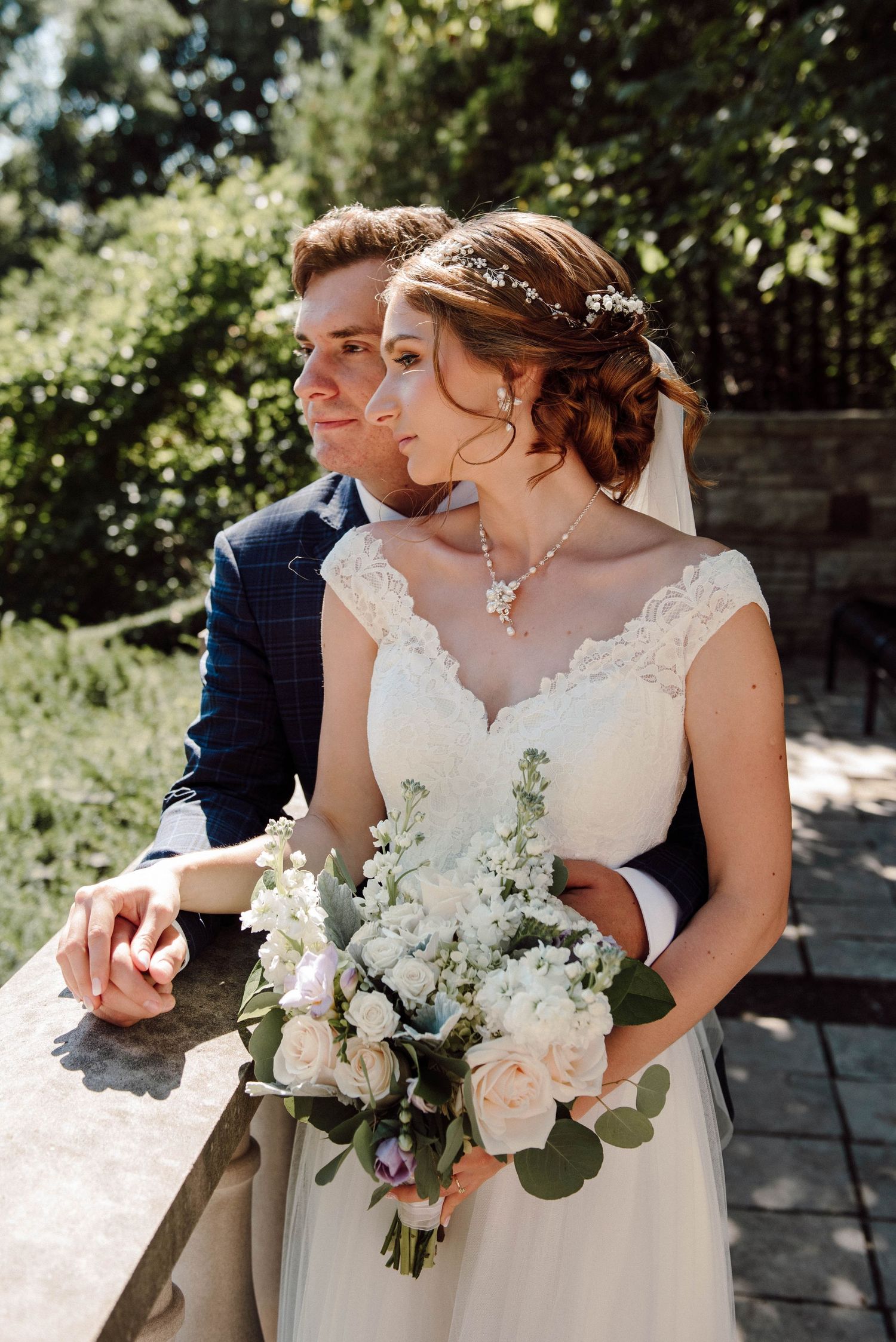 A closeup of the bride and groom as they look out over the lake at Paletta Mansion