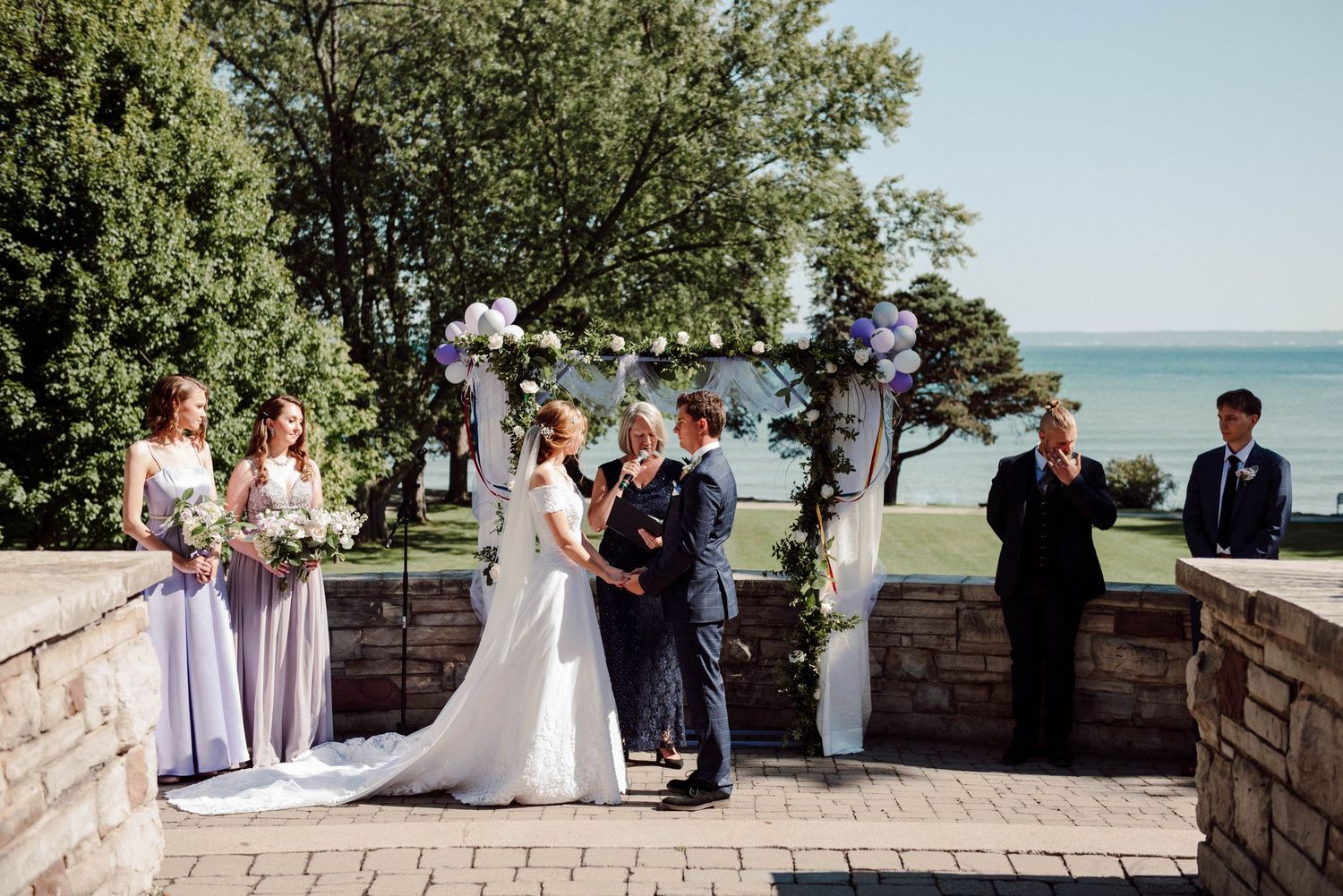 A wedding Ceremony in front of the lake at Paletta Mansion