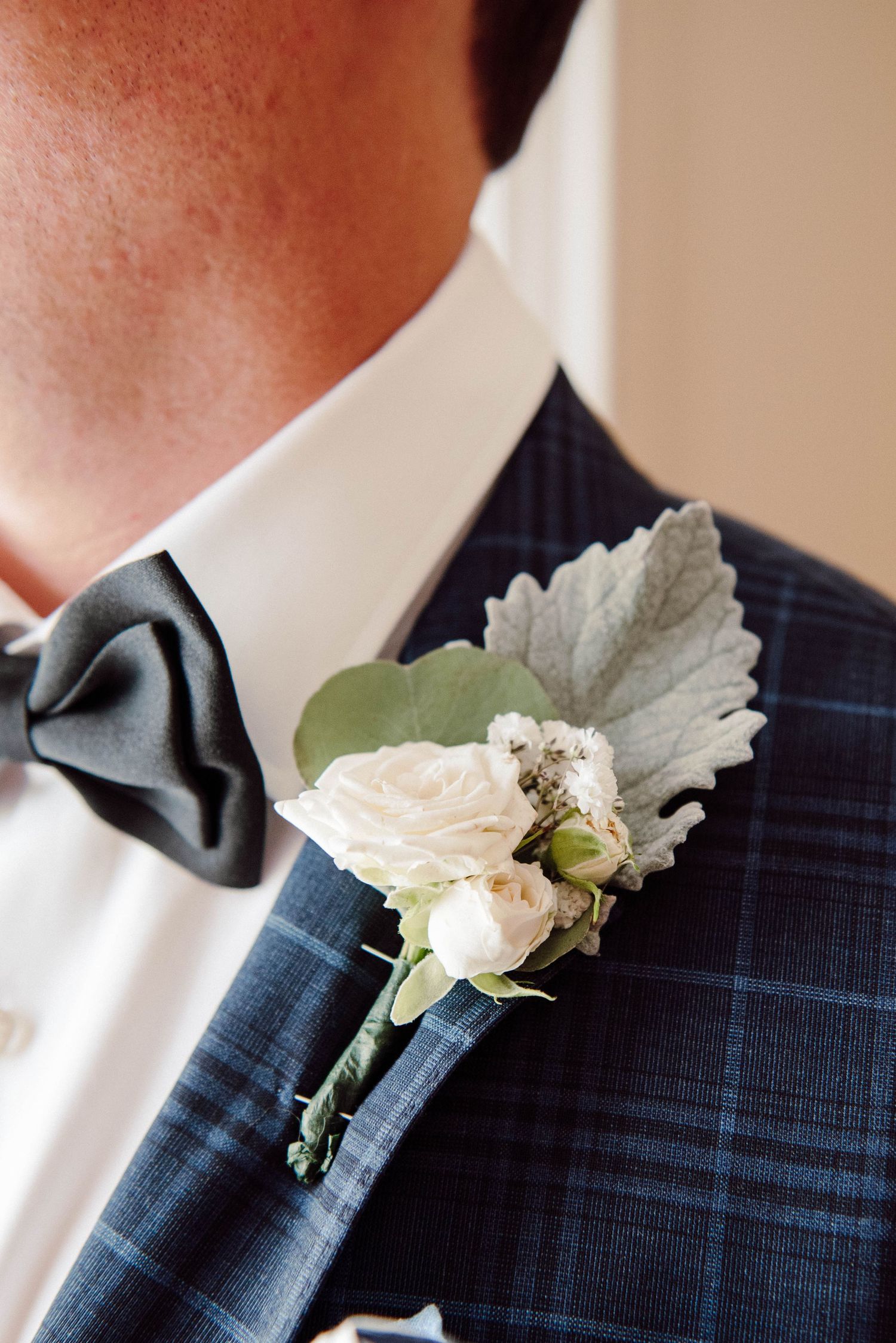 A close up of the grooms boutonniere at Paletta Mansion