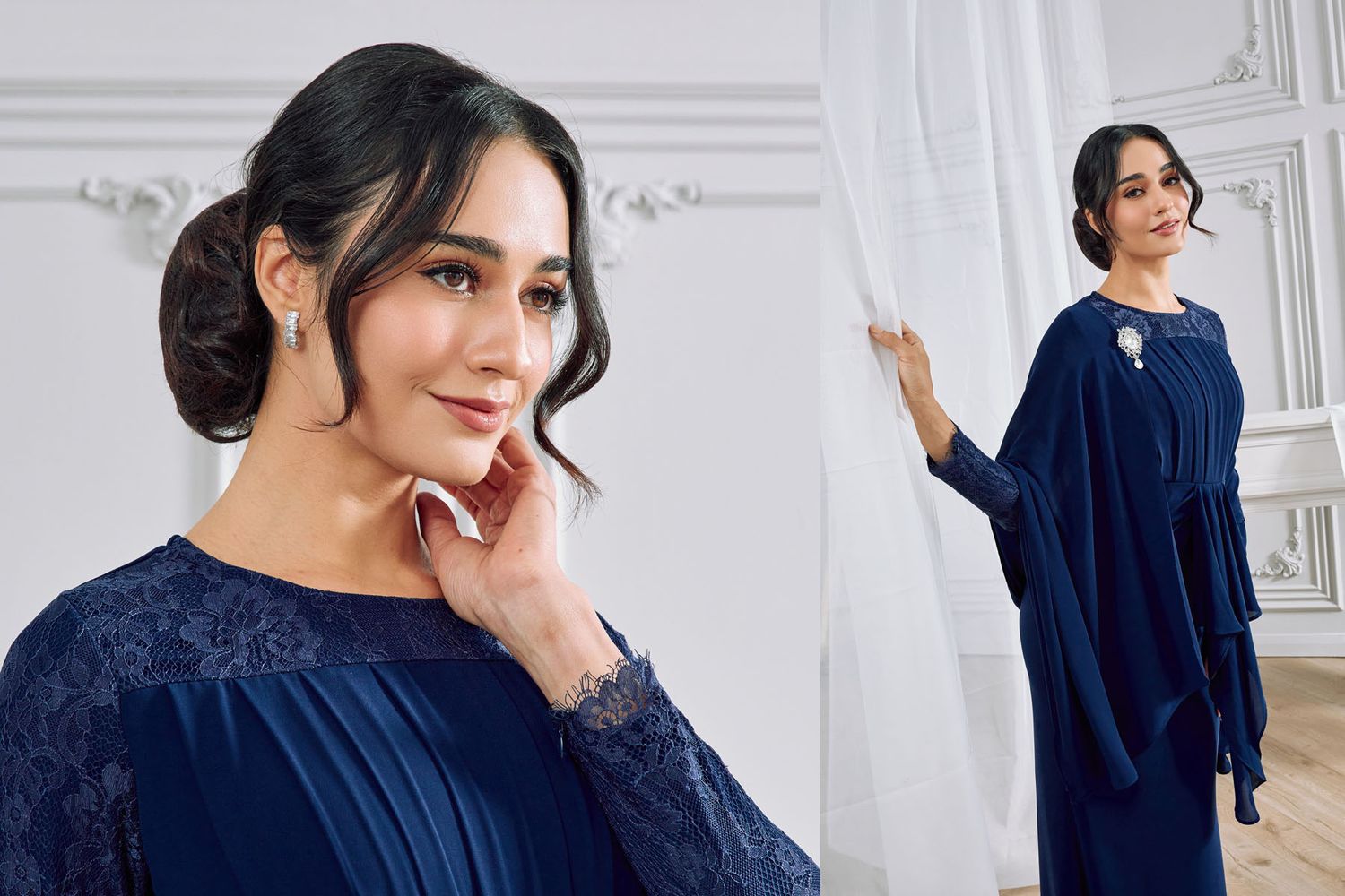 Woman in navy blue lace long gown with cape overlay posing in an elegant white room.