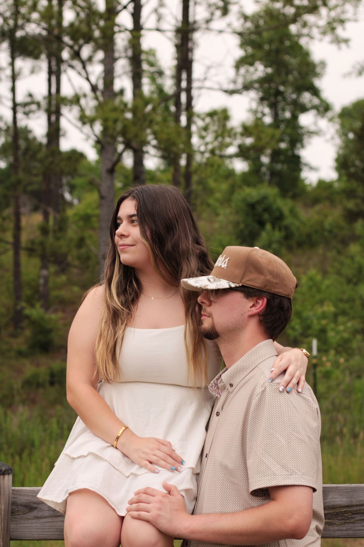 Relaxed seated portrait in natural setting