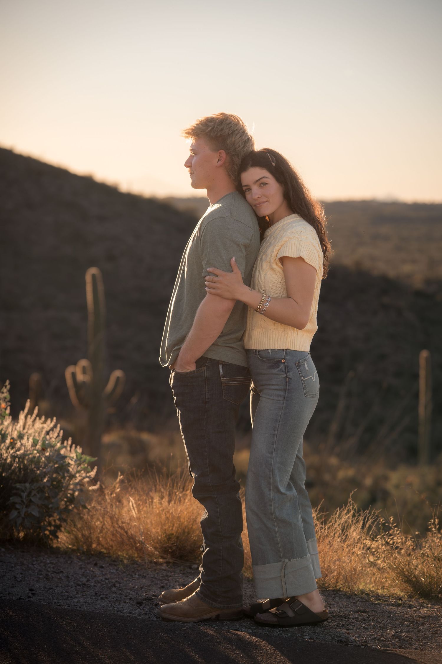 Romantic couple portrait at sunset in Tucson desert landscape with saguaro cactus