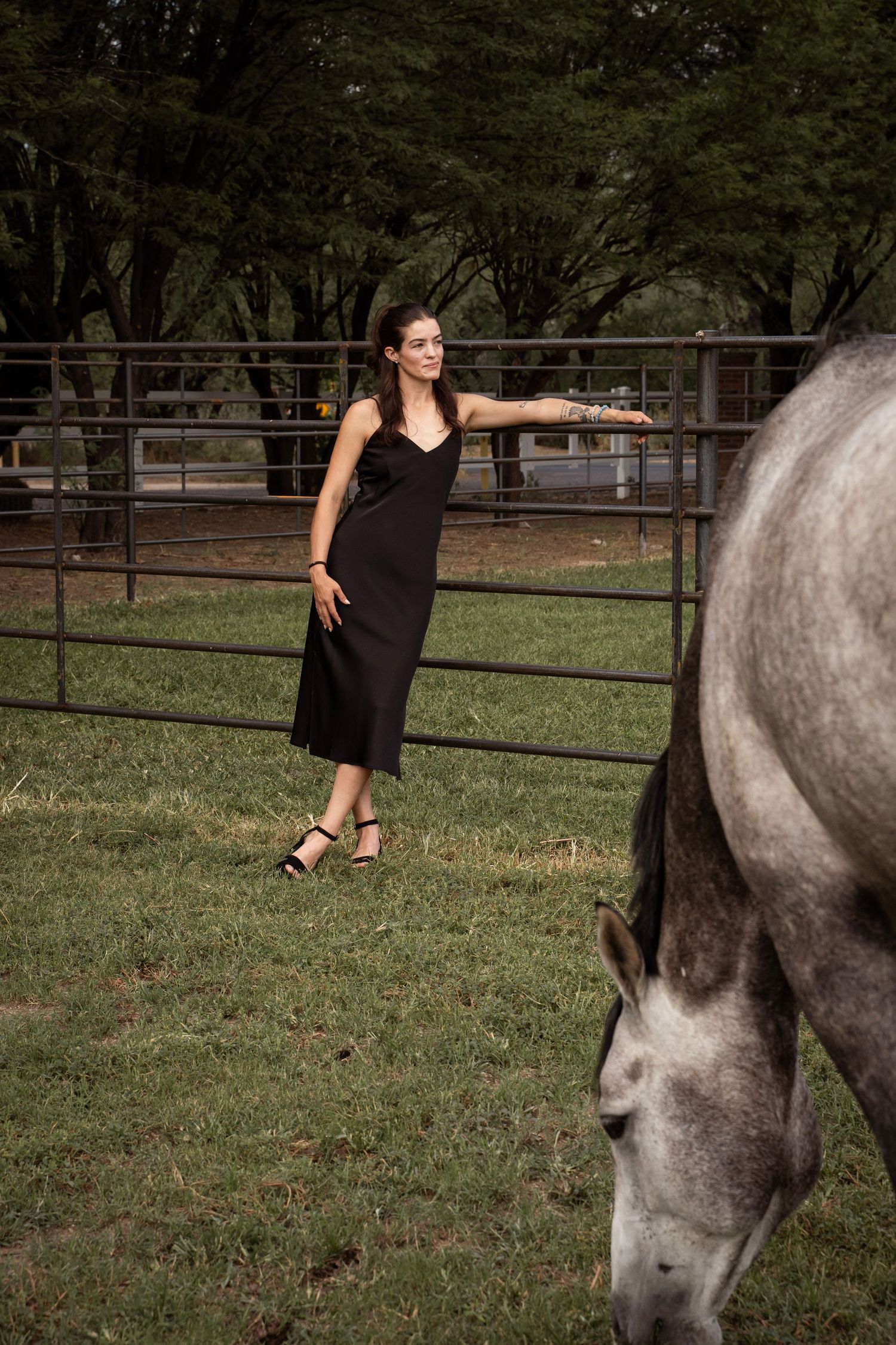 Portrait of girl in field with horse