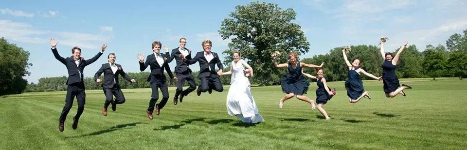 The wedding party jumps for joy !
