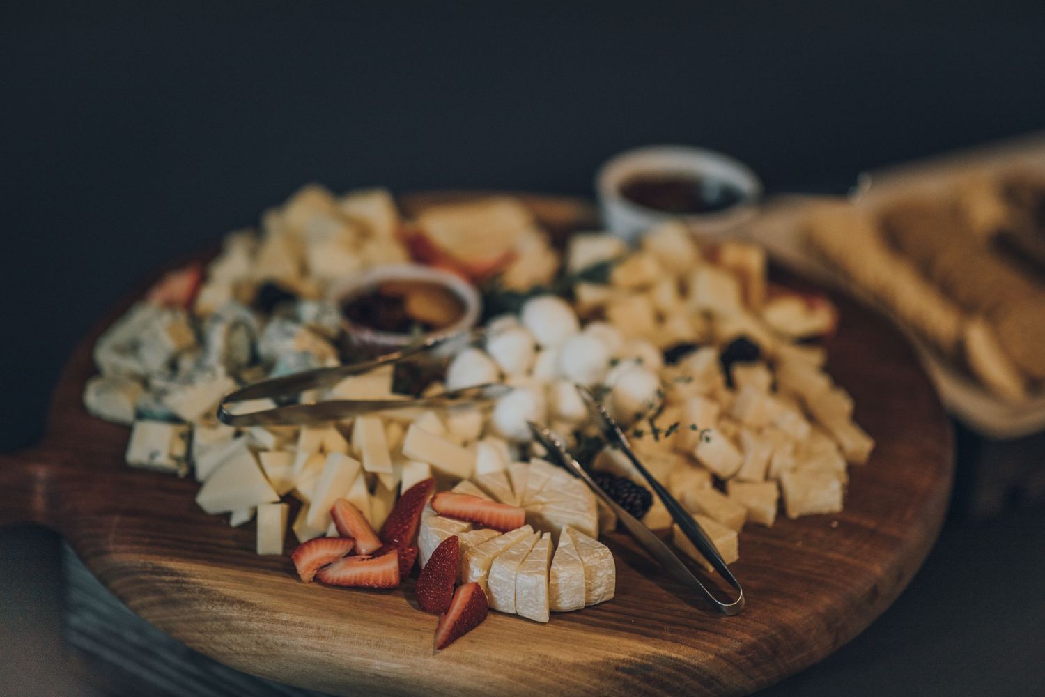 A charcuterie on a circle wooden block at the premiere of the movie, 