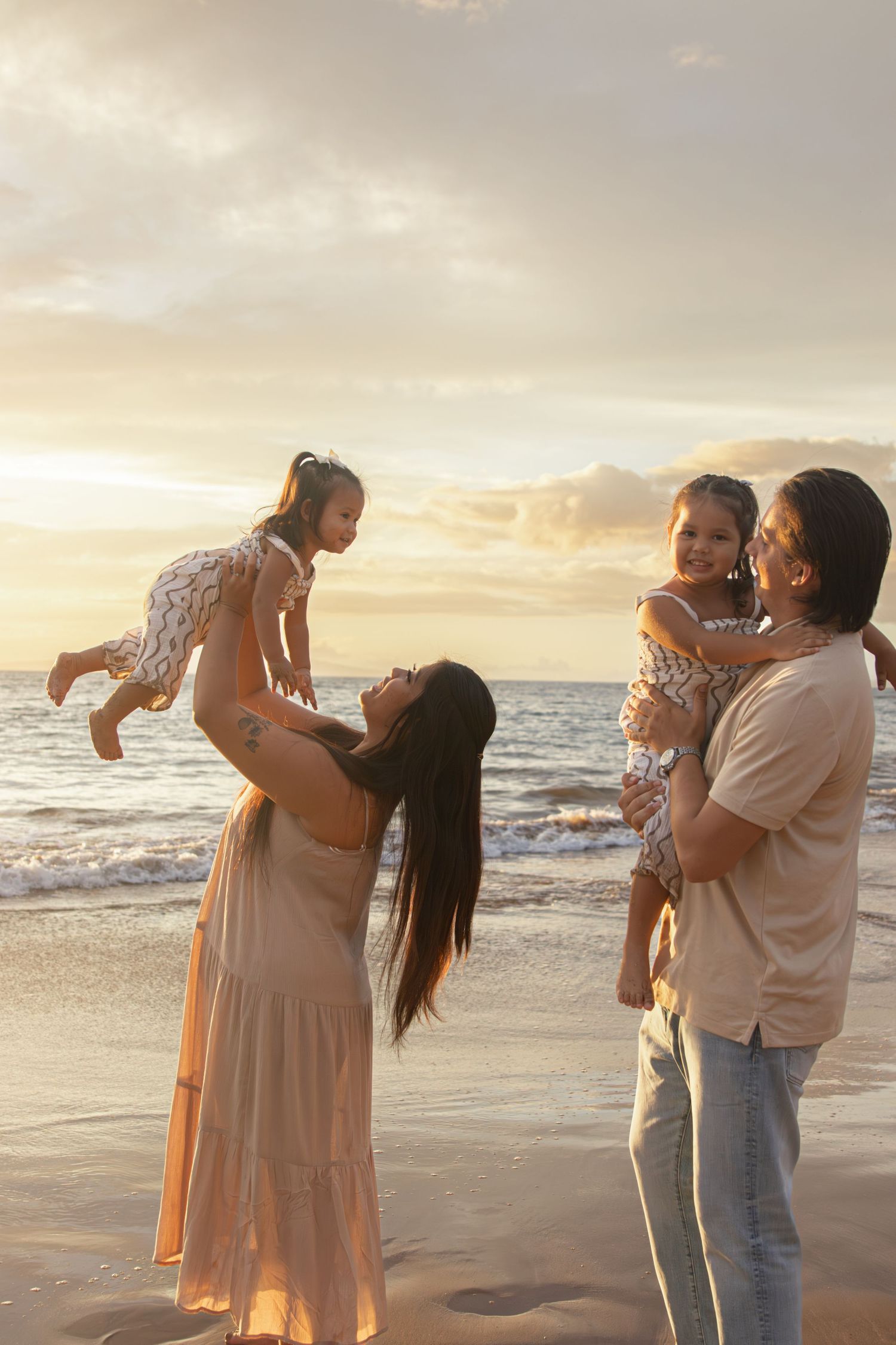 family photoshoot on a beach in maui