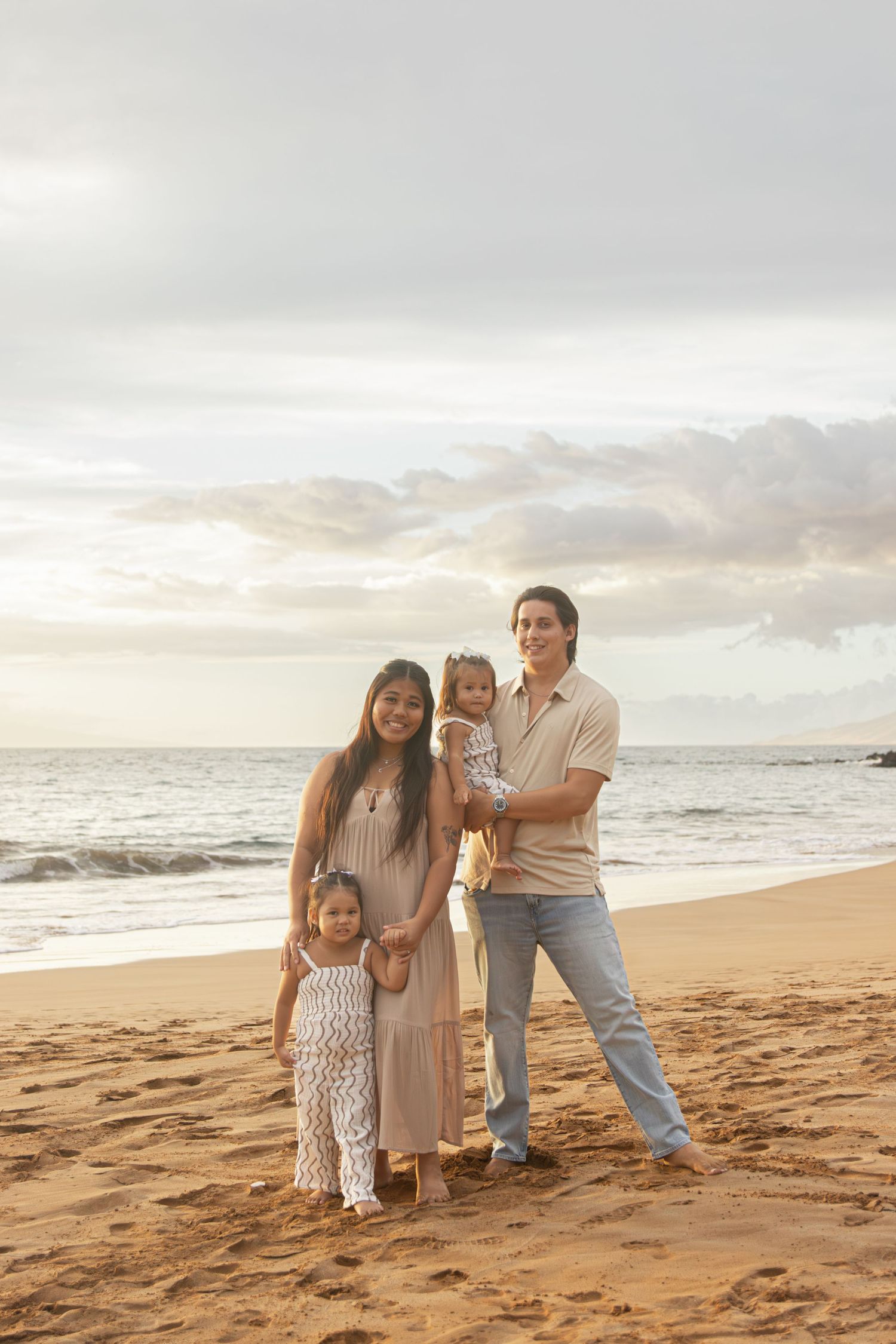 family photoshoot on a beach in maui