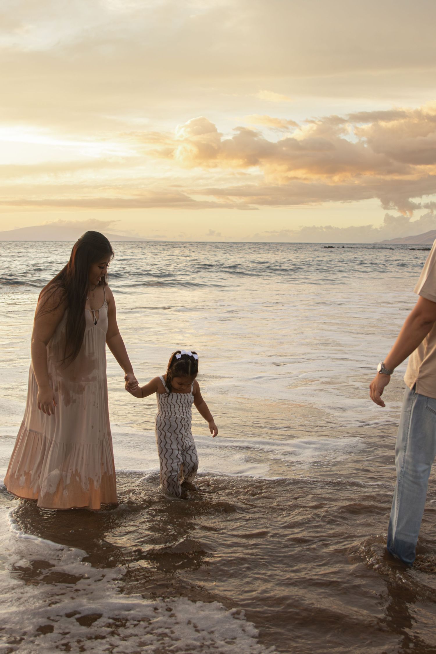 family photoshoot on a beach in maui