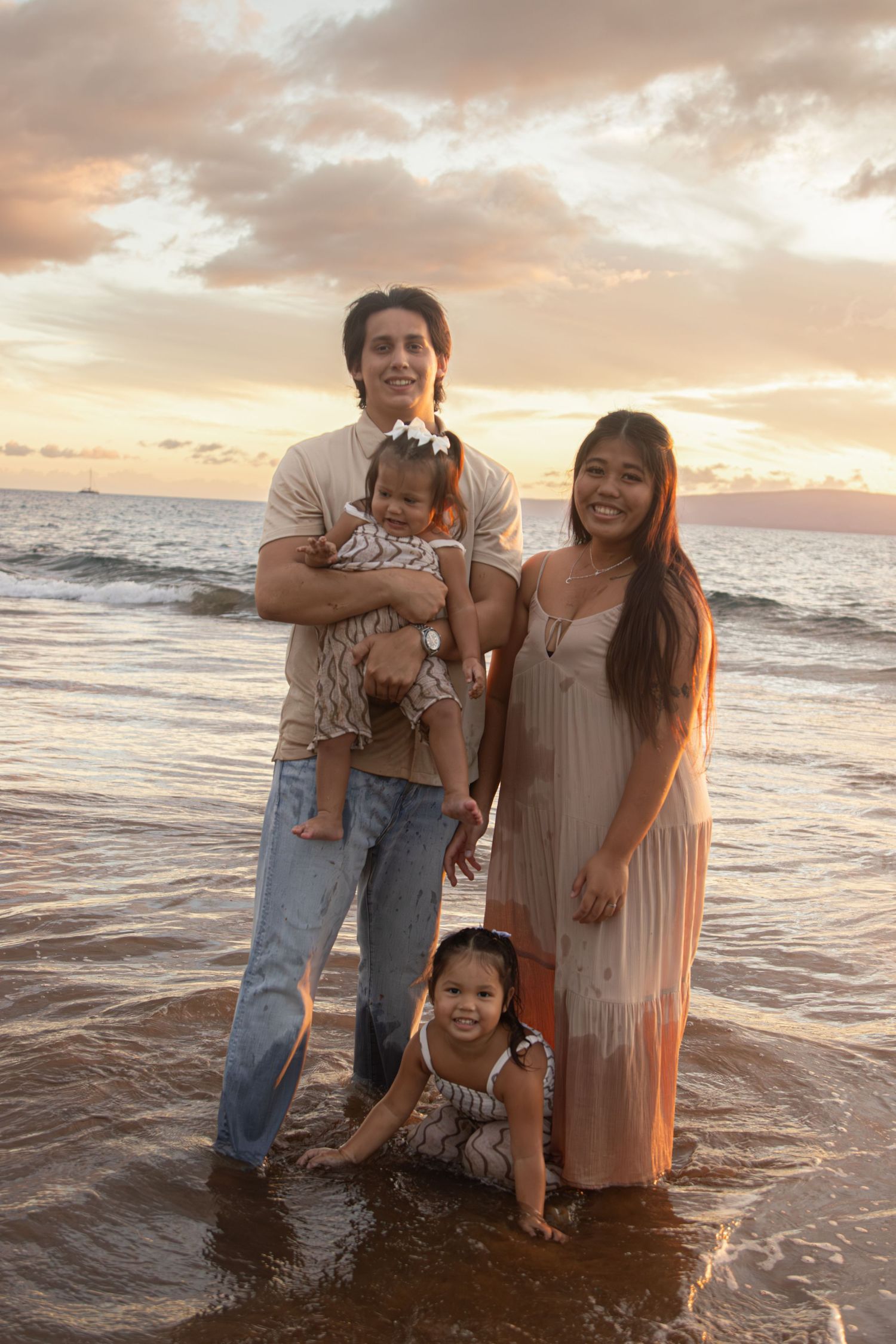 family photoshoot on a beach in maui