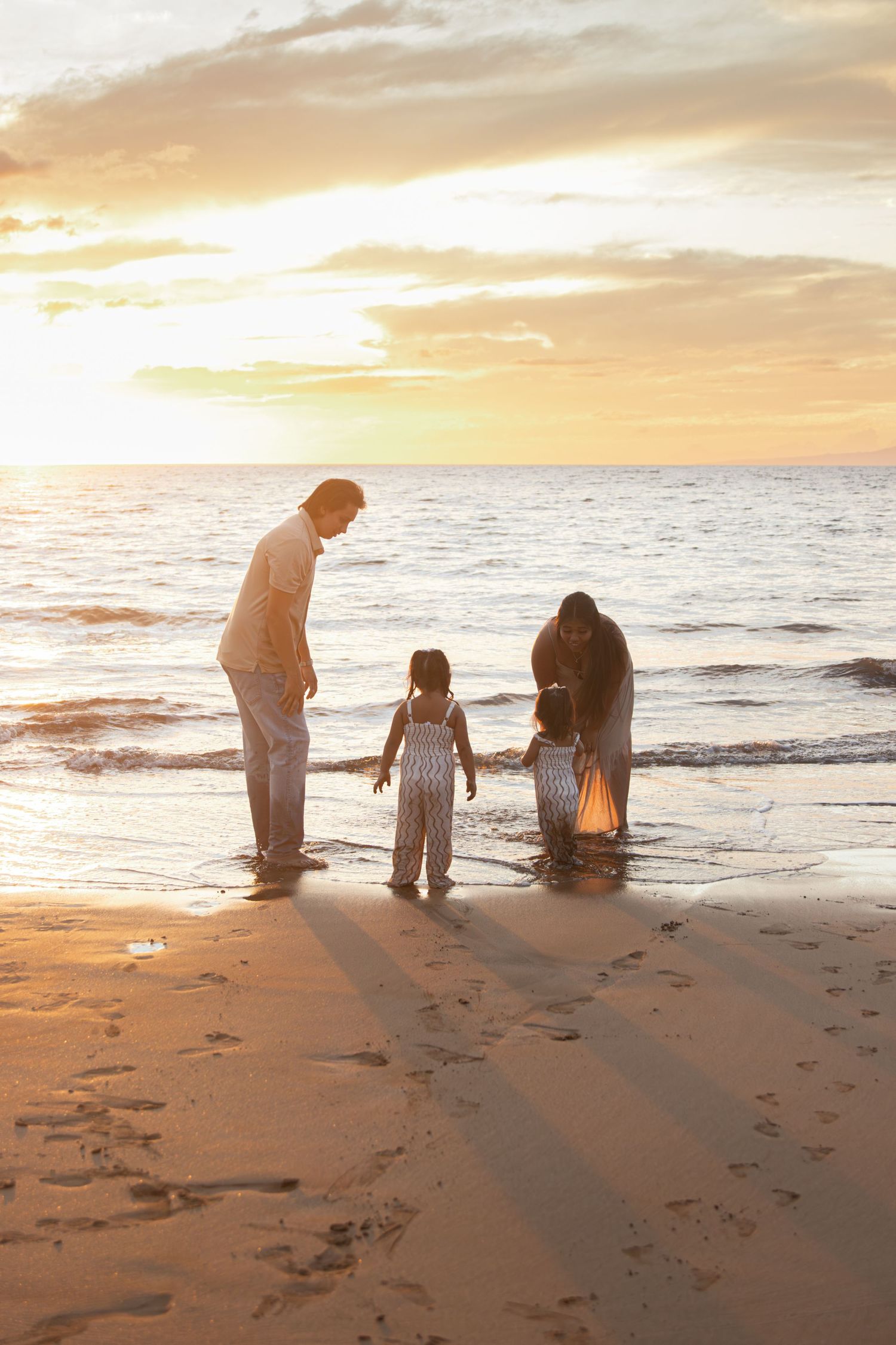 family photoshoot on a beach in maui