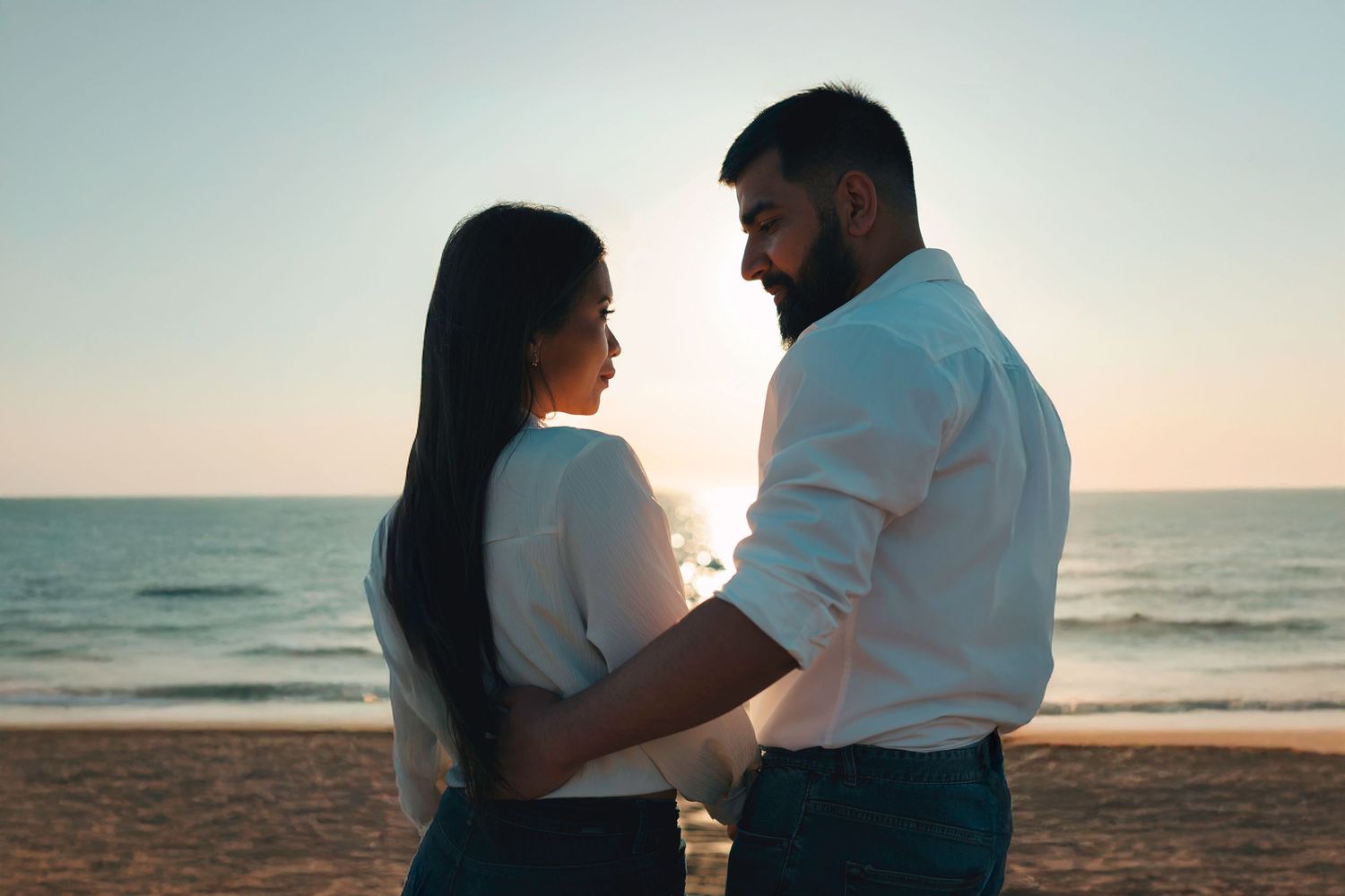 Couple enjoying a romantic engagement sunset at the beach in Adelaide