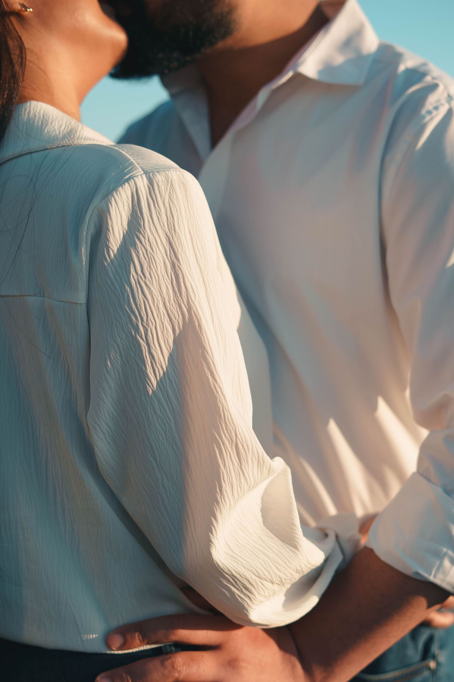 Romantic moment of a couple kissing during a portrait session