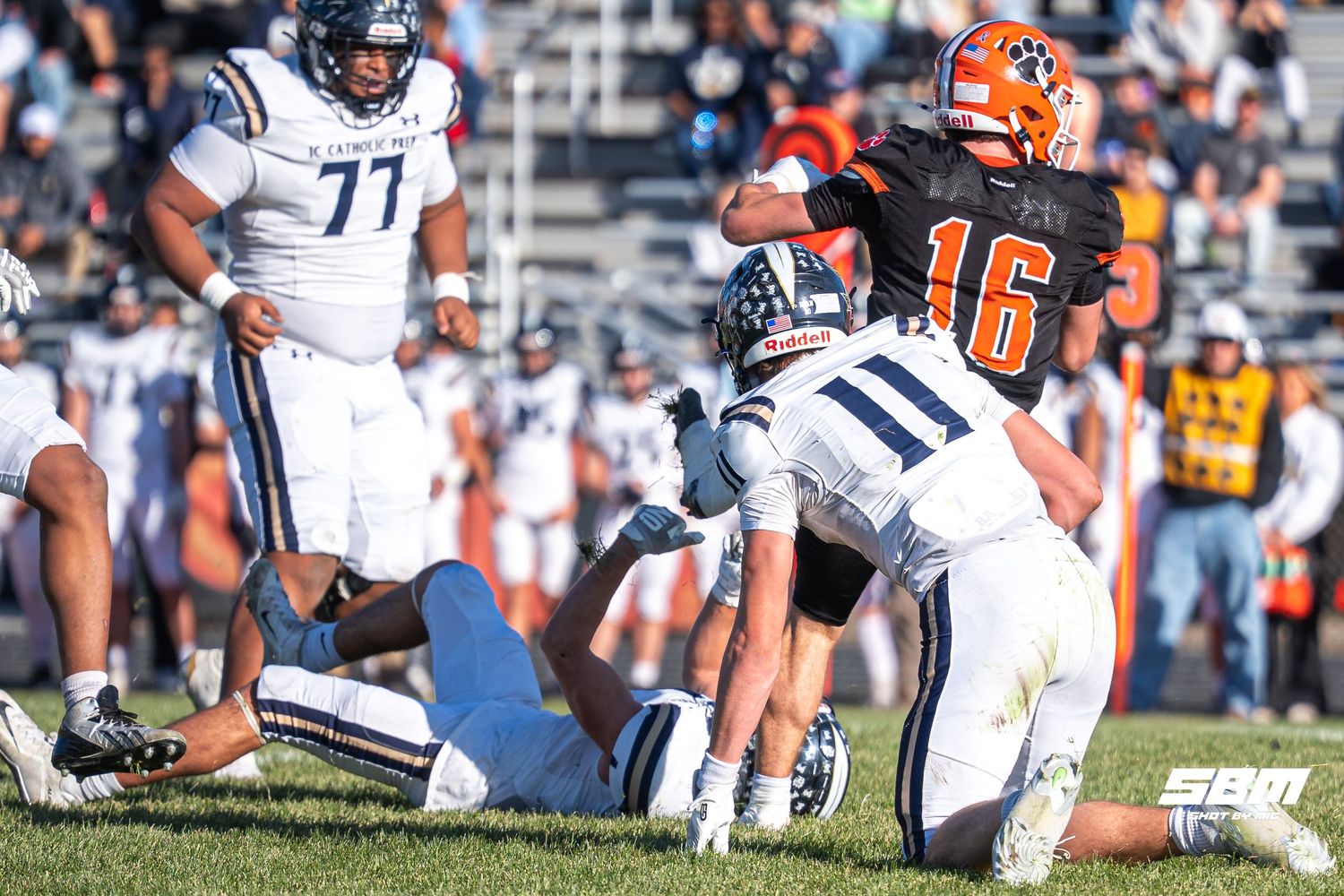 Byron's Andrew Talbert (16) getting past multiple IC Catholic players to advance for the first down during their 28-6 upset win over ICCP.