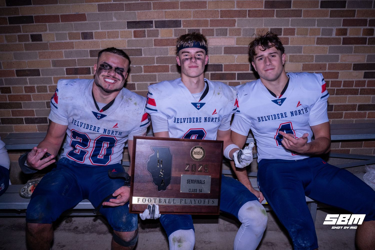 Belvidere North's Erick Roman (left) Jackson Johnson (middle) and Air Force commit Ben Bucher (right) pose for a photo after their win.
