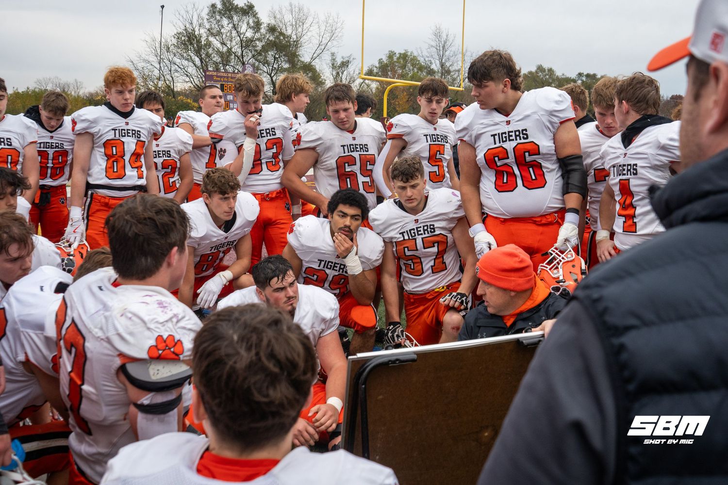 Byron head coach Jeff Boyer gives his players what to improve at halftime during their 14-13 loss against Montini Catholic.