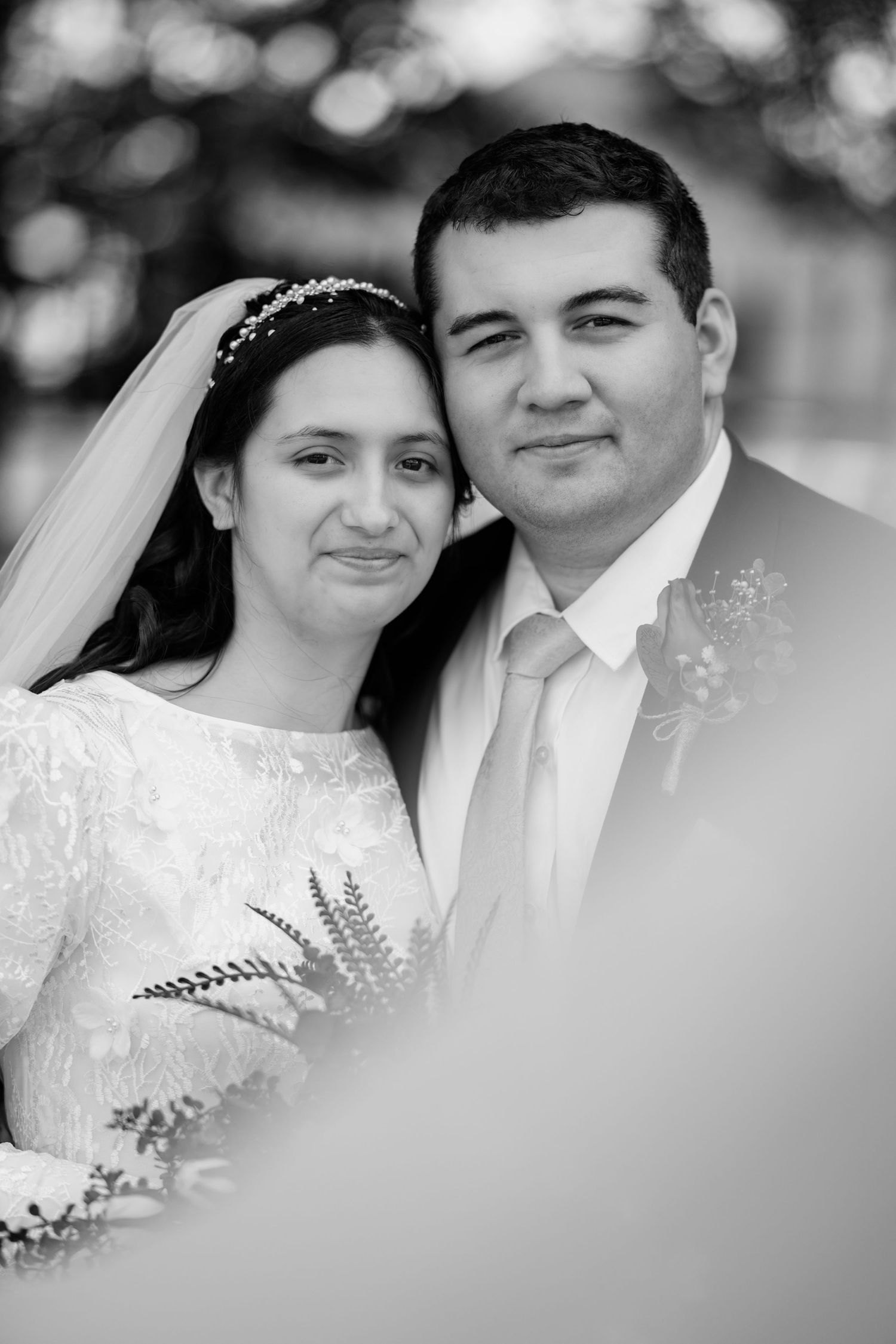 A series of black and white romantic wedding portraits showing tender moments between a couple on their special day.