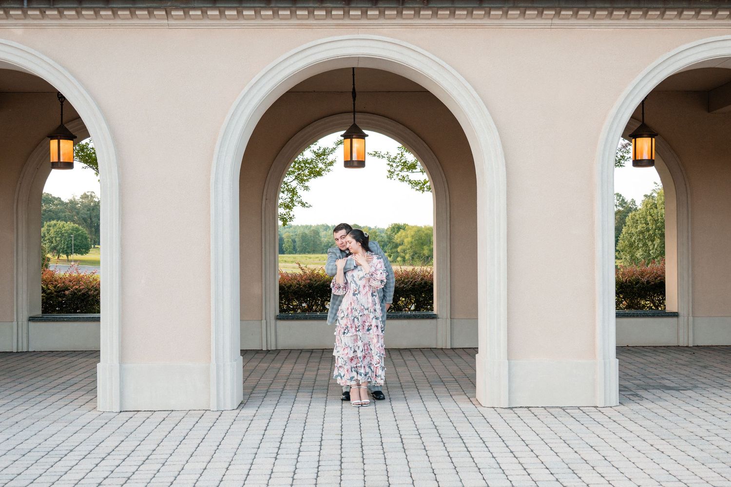 Series of wedding portraits framed within elegant white archways creating symmetrical compositions.