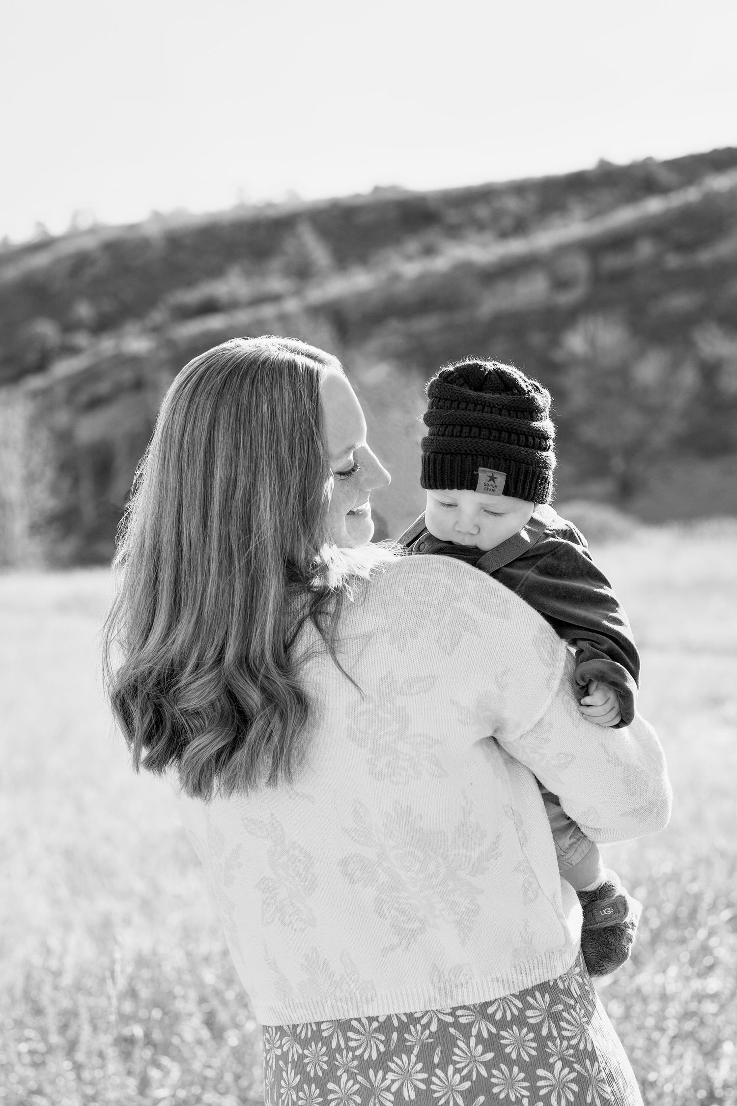 Black and white photo of a mother and baby portrait outdoors at Lory State Park.