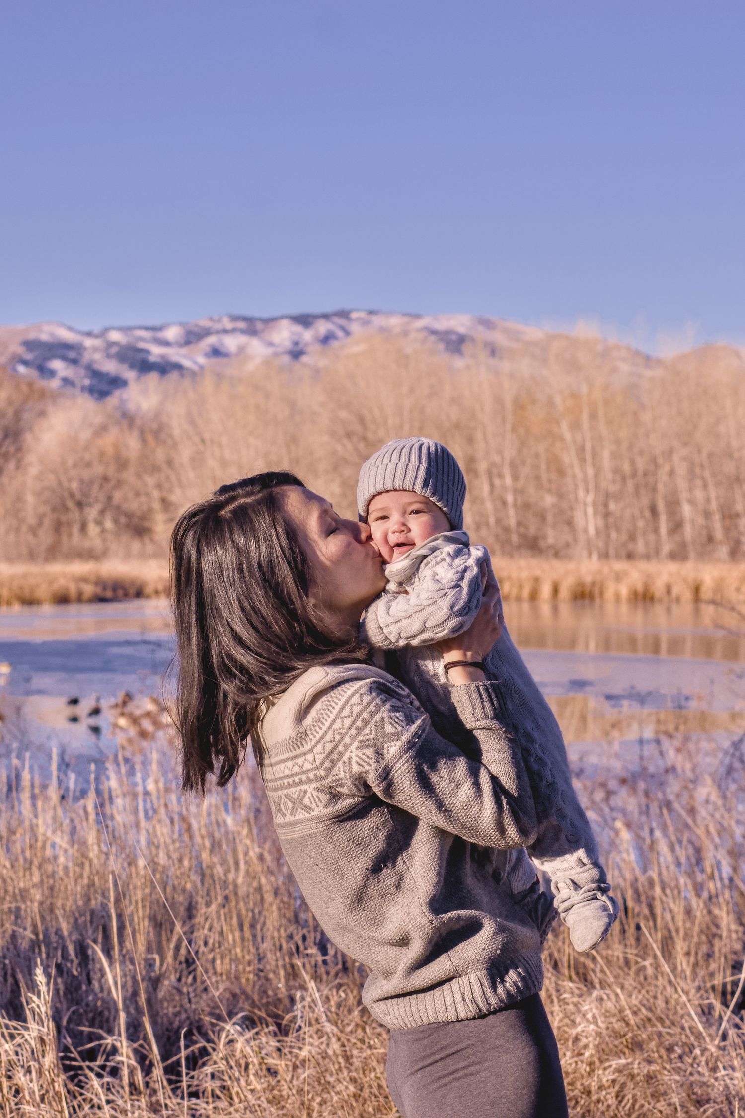 A portrait of a mother and a baby daughter taken outdoors in the winter in Fort Collins, Colorado.