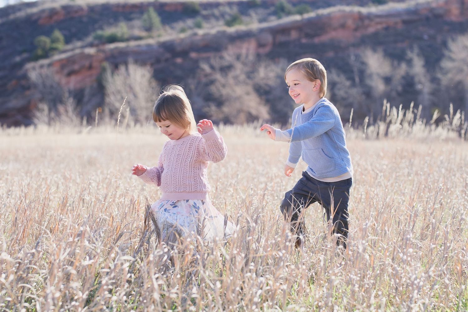 Kids running through the field at Lory State Park.