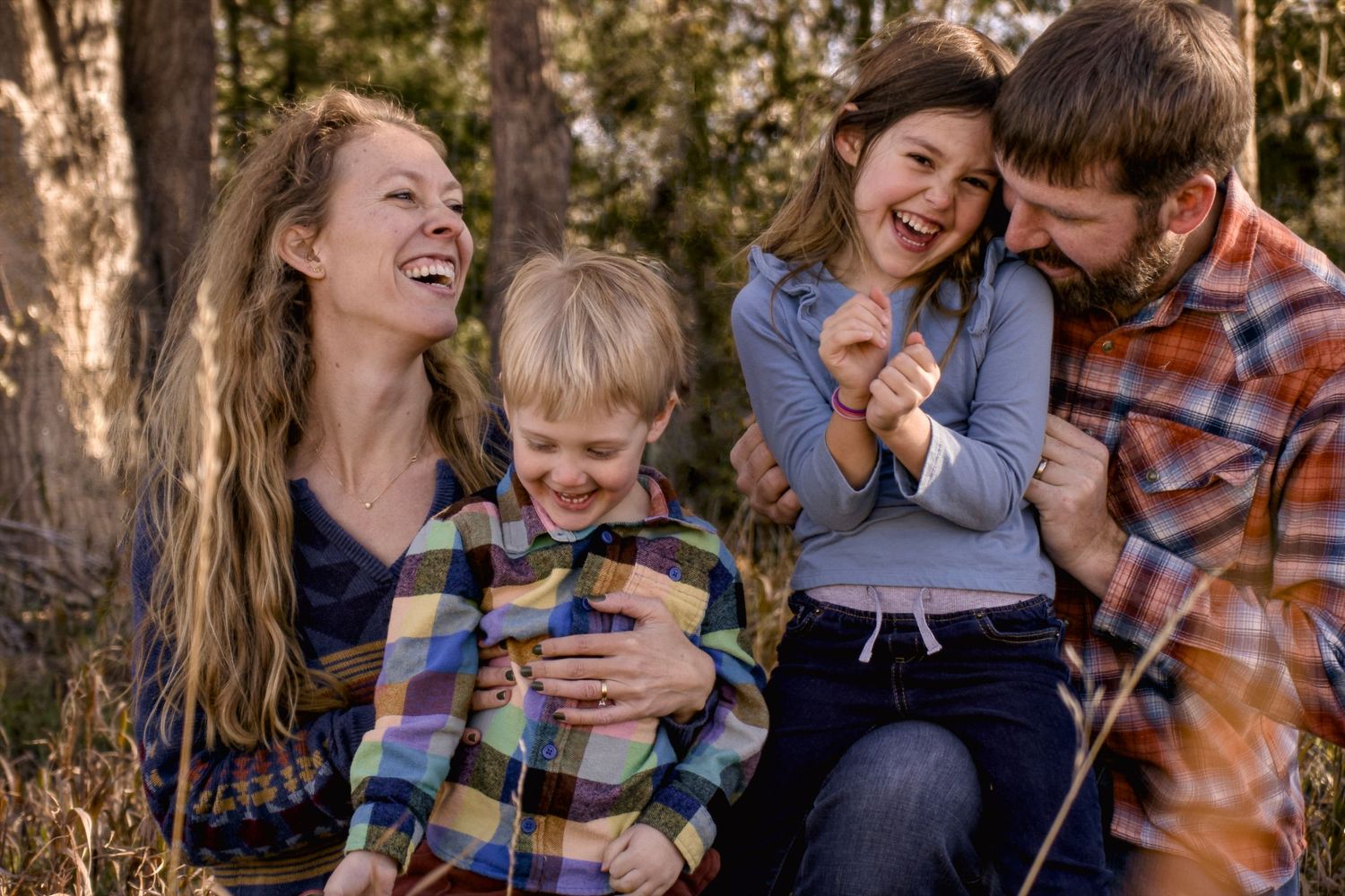 A portrait of a family of four Proof of mom picture. Taken outdoors in fall/autumn in Fort Collins, Colorado.