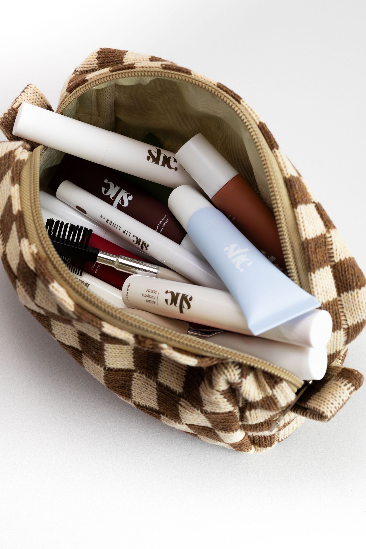 Product Photography in pouch with luxury products on a clean white background