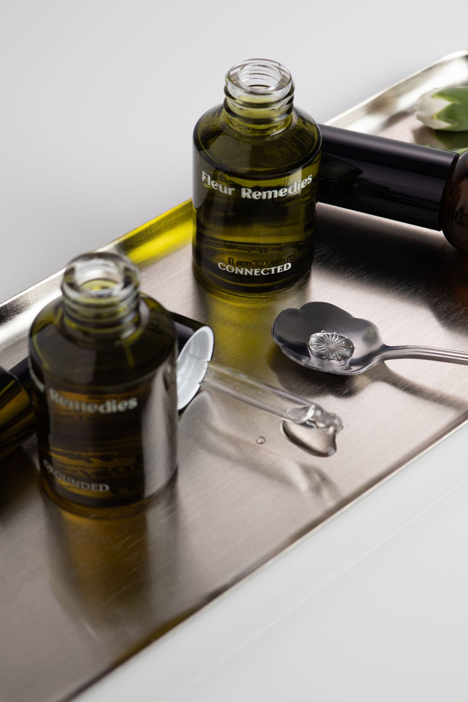 Remedies shot by UK-based product photographer green bottles Glow Studio Yalda