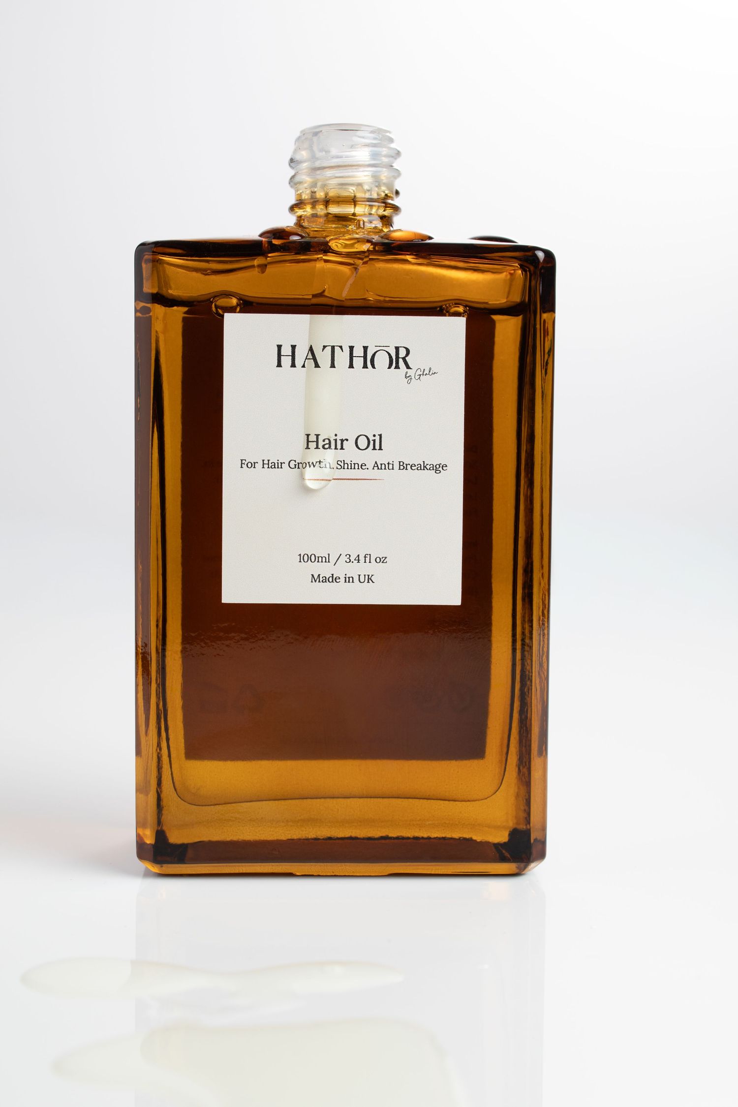 oil drip shot taken by UK product photographer ombre bottle by Glow Studio Yalda