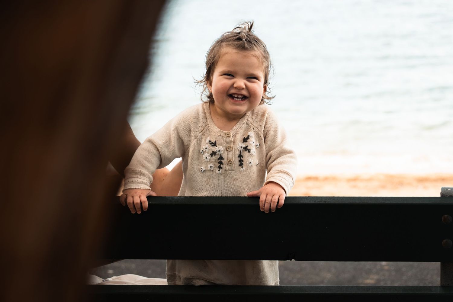 A series of joyful moments captured in black and white photographs showing expressions of happiness and laughter.