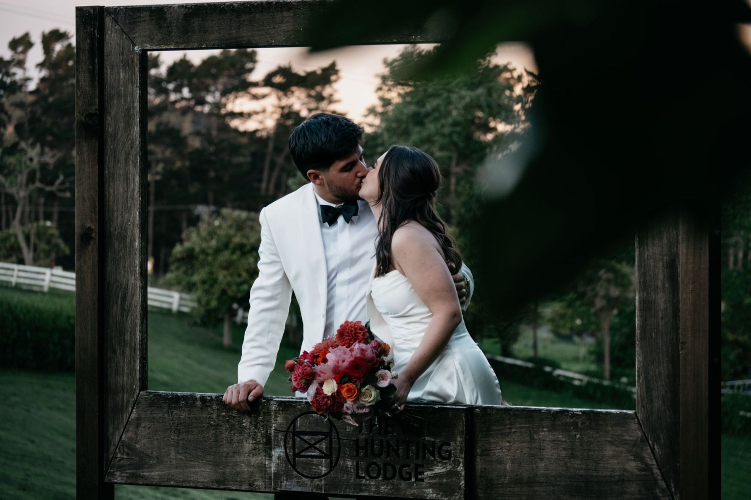A romantic wedding photo sequence showing tender moments between a couple in formal attire at sunset.