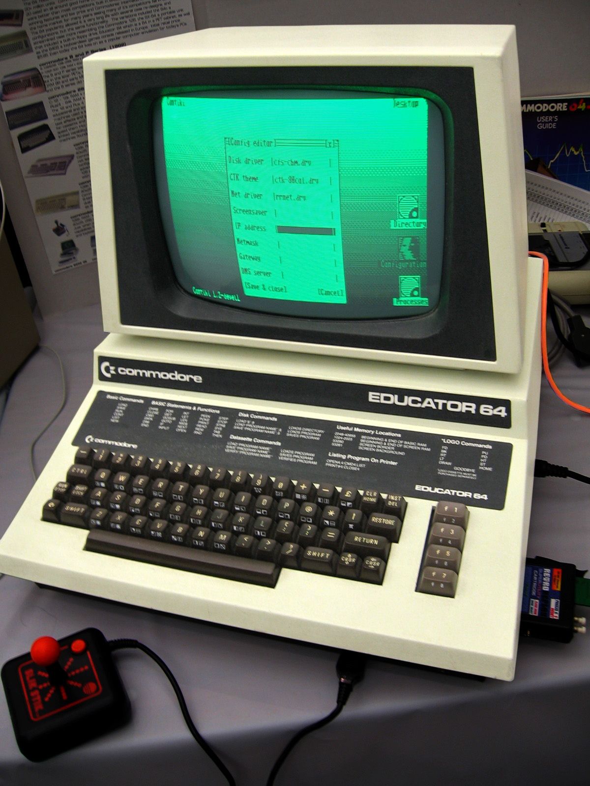 A Commodore 64 Educator computer system with green monochrome display showing text on multiple monitors.