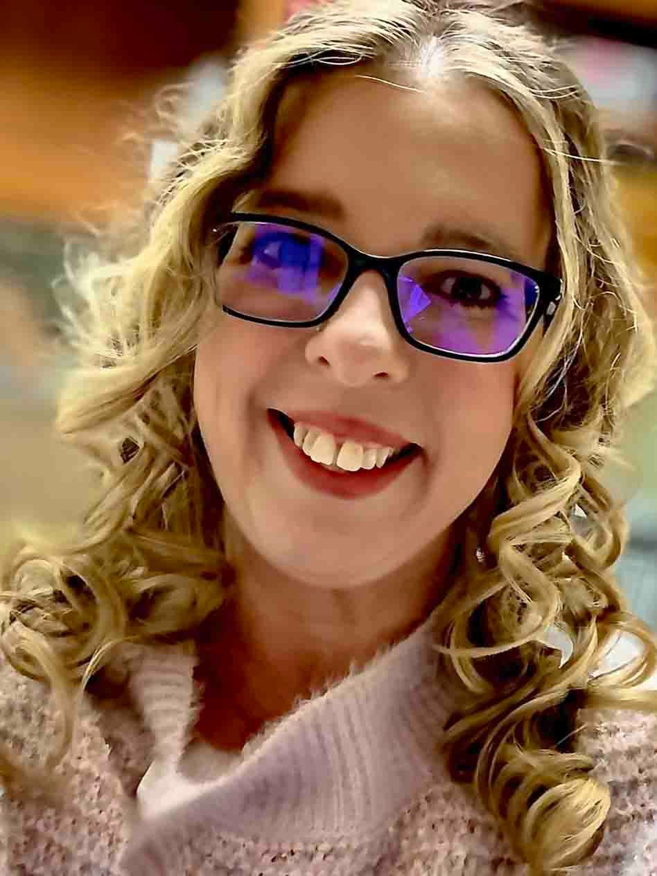 A person with curly blonde hair and glasses smiles warmly in a series of close-up photos.