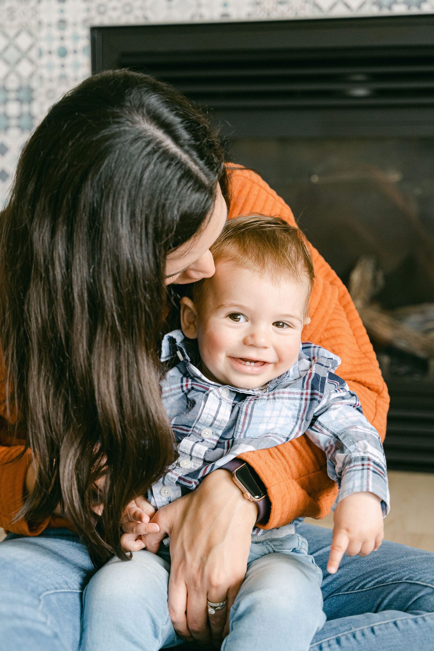 A playful sequence of family moments showing cuddles and laughter on a couch in casual attire.