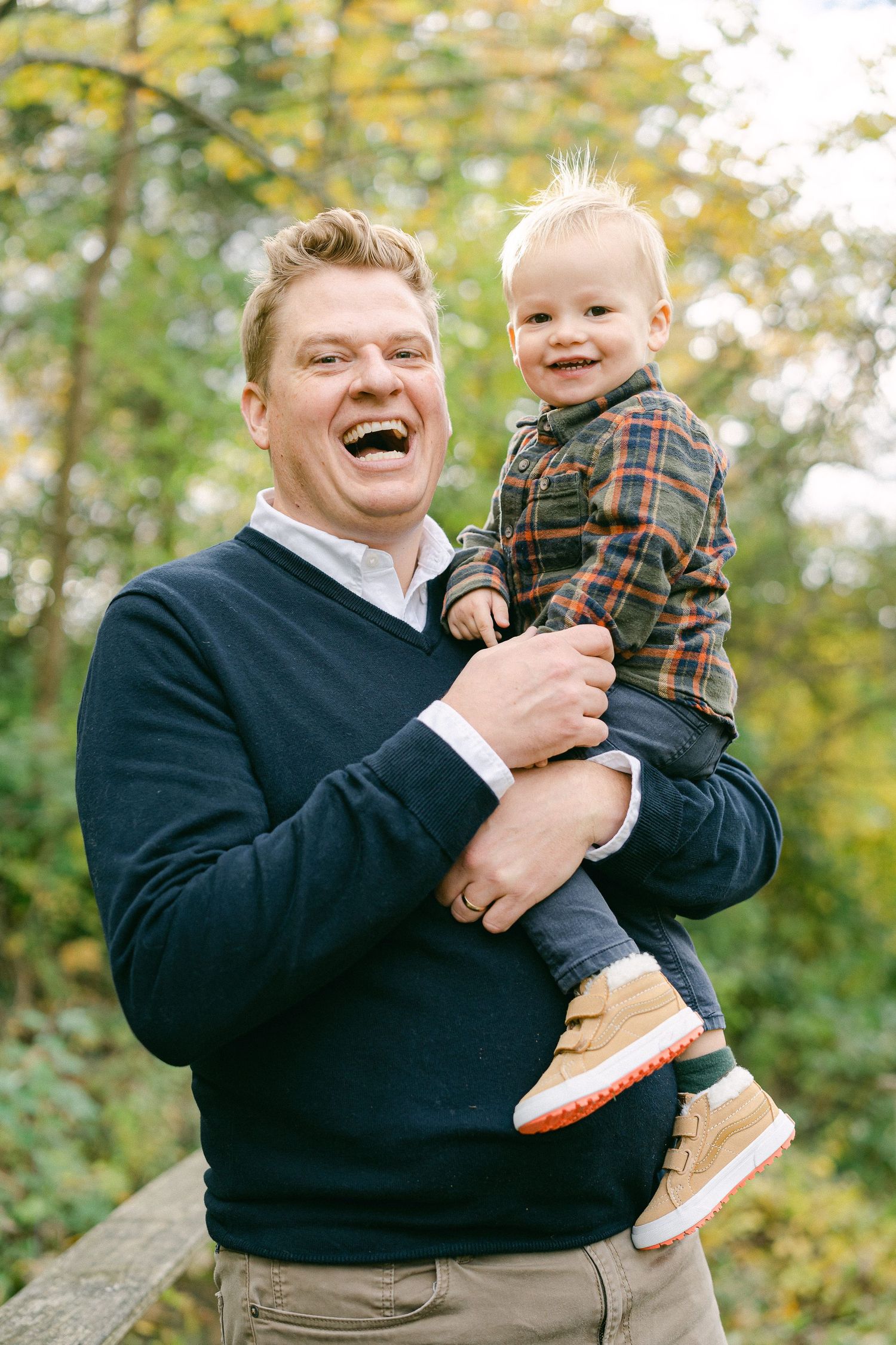 A progression of candid laughing moments between parent and child in an outdoor autumn setting.