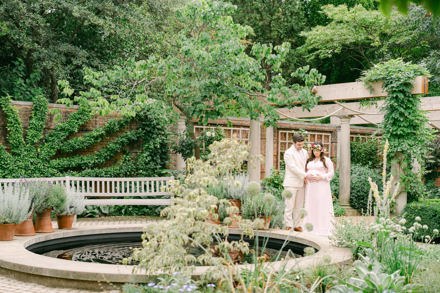 A peaceful garden path leads through lush greenery with stone steps and ornate architectural details.