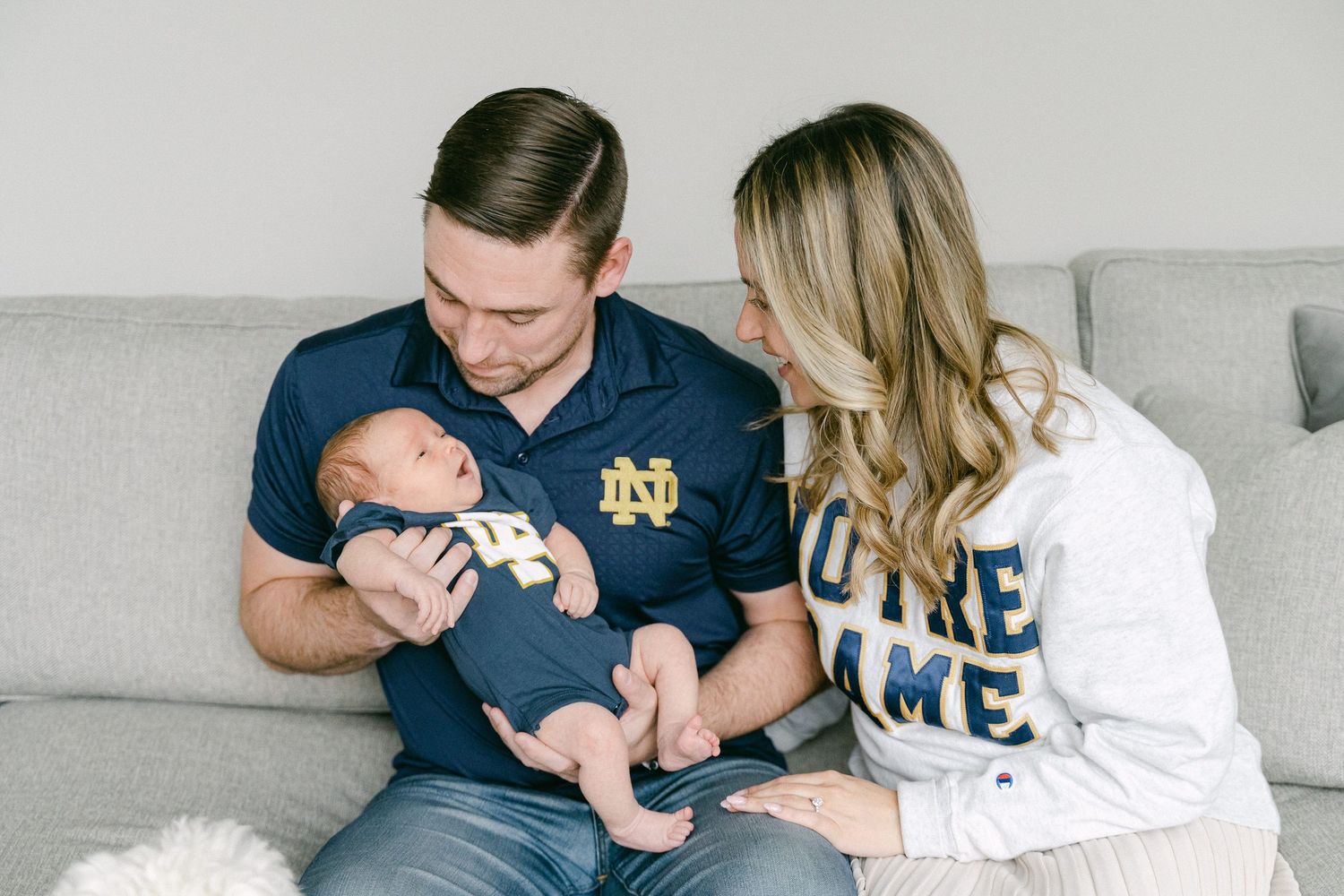 A series of tender family moments showing parents bonding with their newborn baby in a home setting.