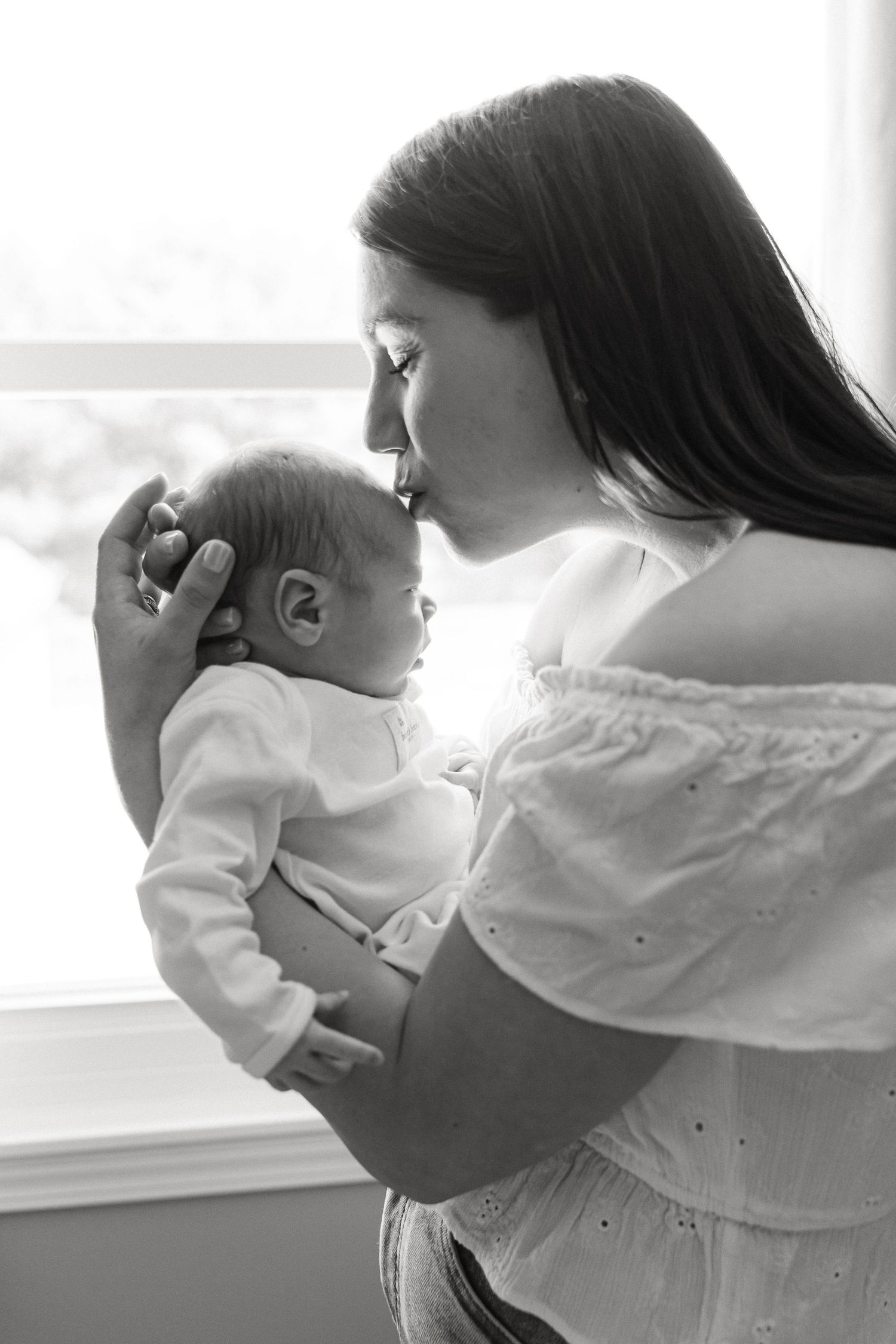 Black and white image series showing tender moments in soft, natural light.