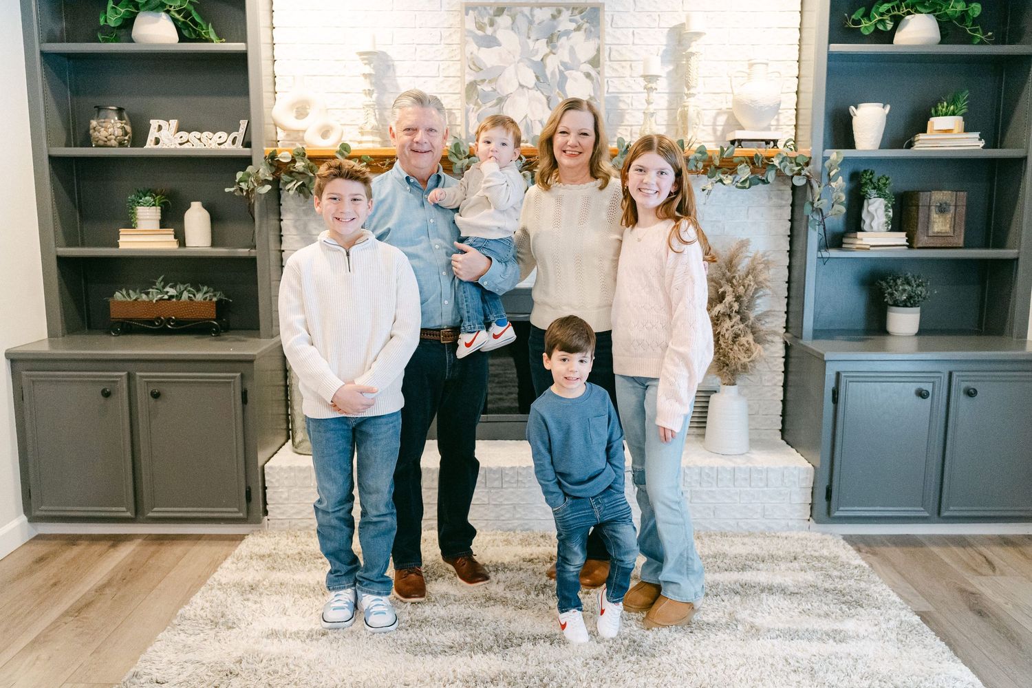 A collage of family photos showing people sitting and standing together in a cozy living room setting.