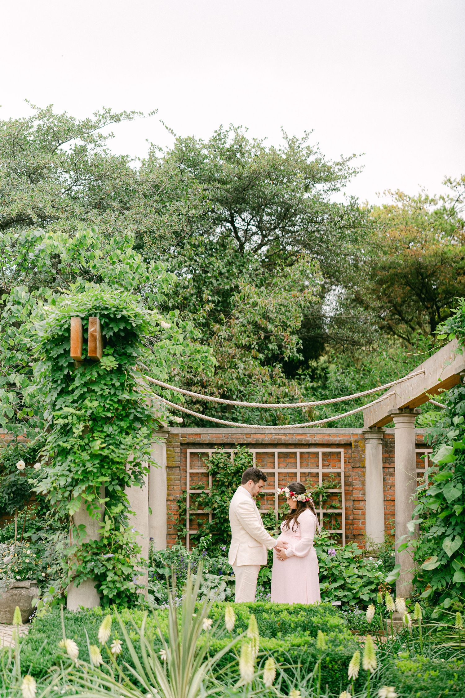 A series of garden photos showing a lush green space with wooden trellises and decorative structures.