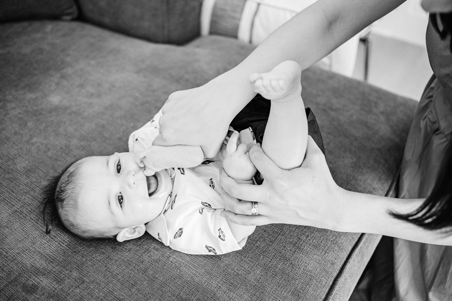 A sequence of black and white photos showing white sneakers and legs performing a dance move or step sequence.