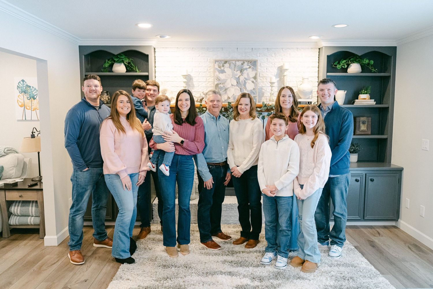 A series of four interior photos showing people gathered in a modern living room space.