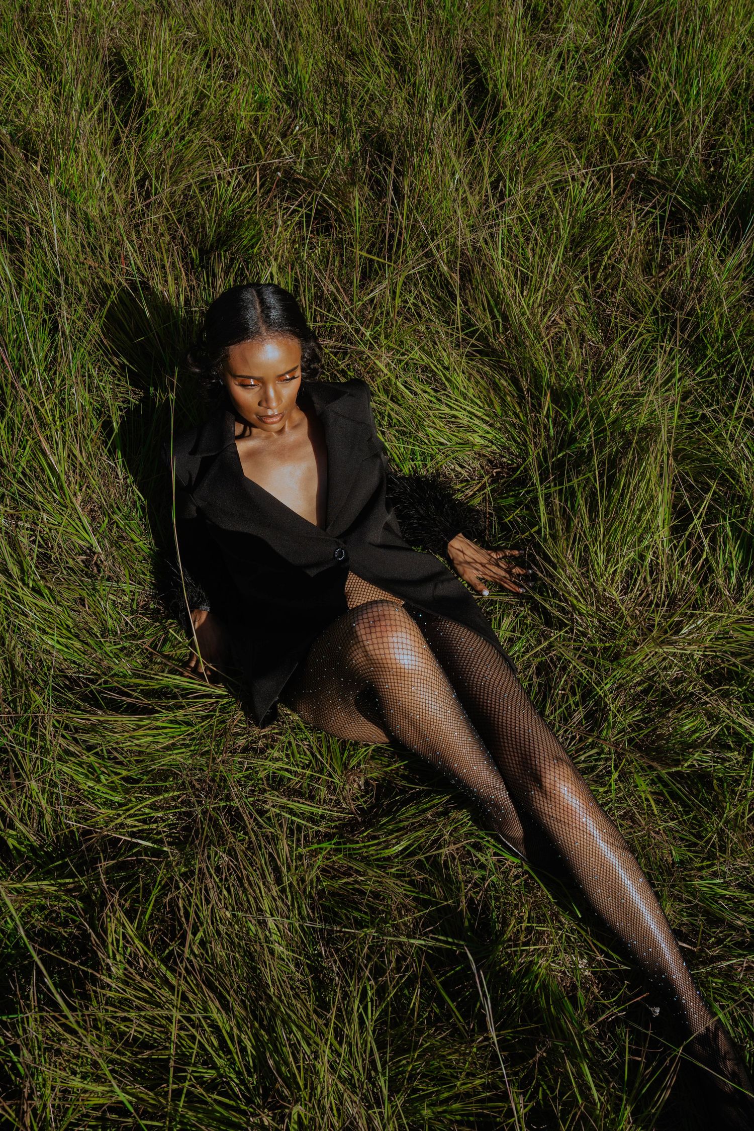 Girl in tall grass posing-editorial