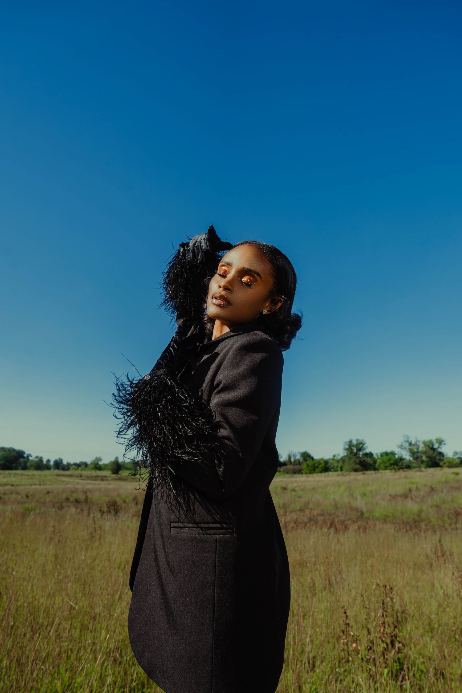 Girl in tall grass posing-editorial