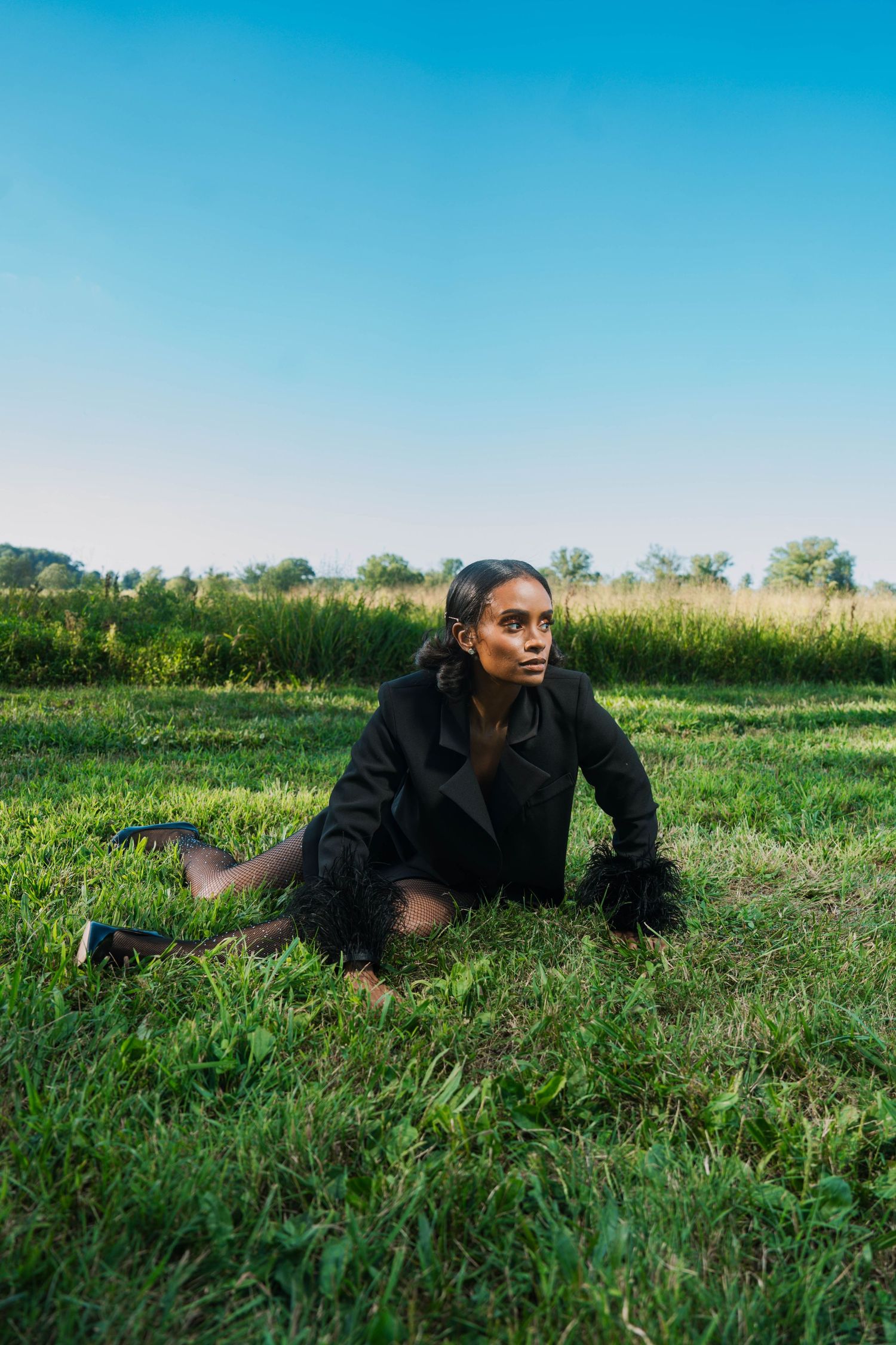 Girl in tall grass posing-editorial