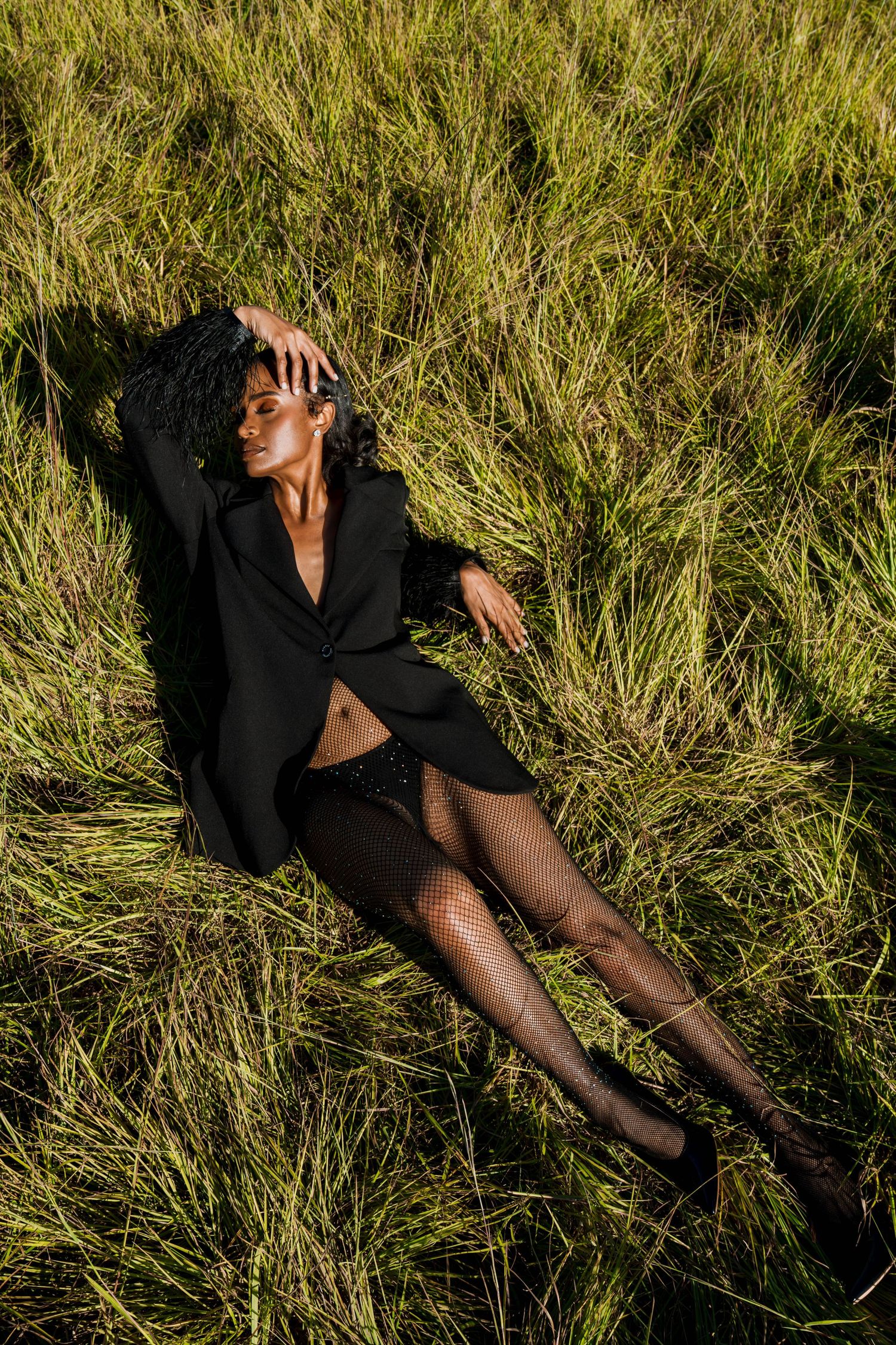 Girl in tall grass posing-editorial