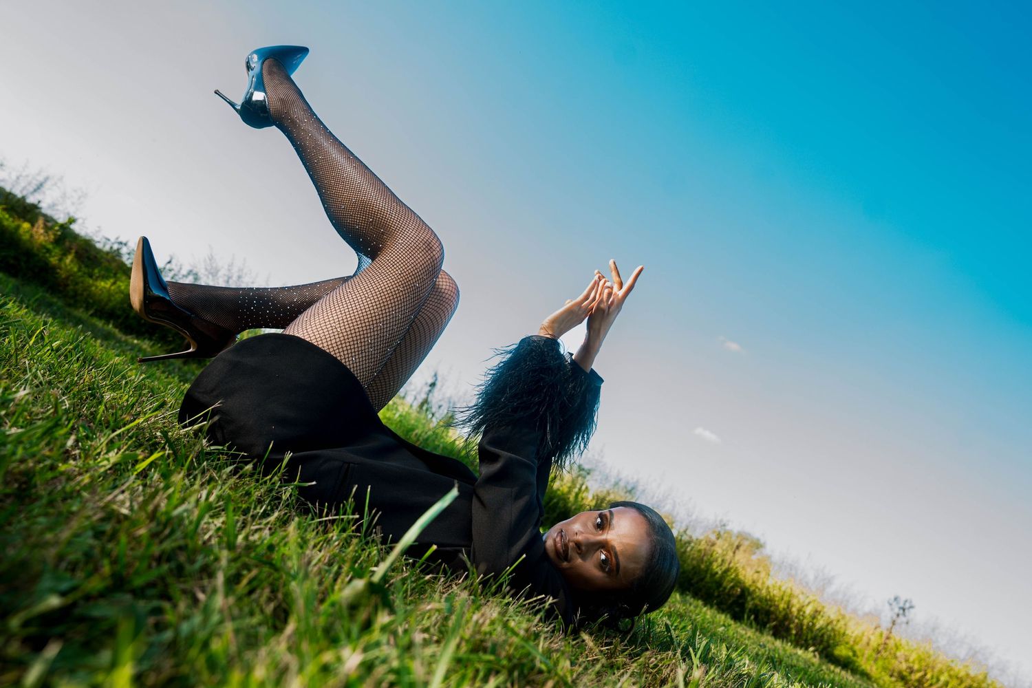 Girl in tall grass posing-editorial